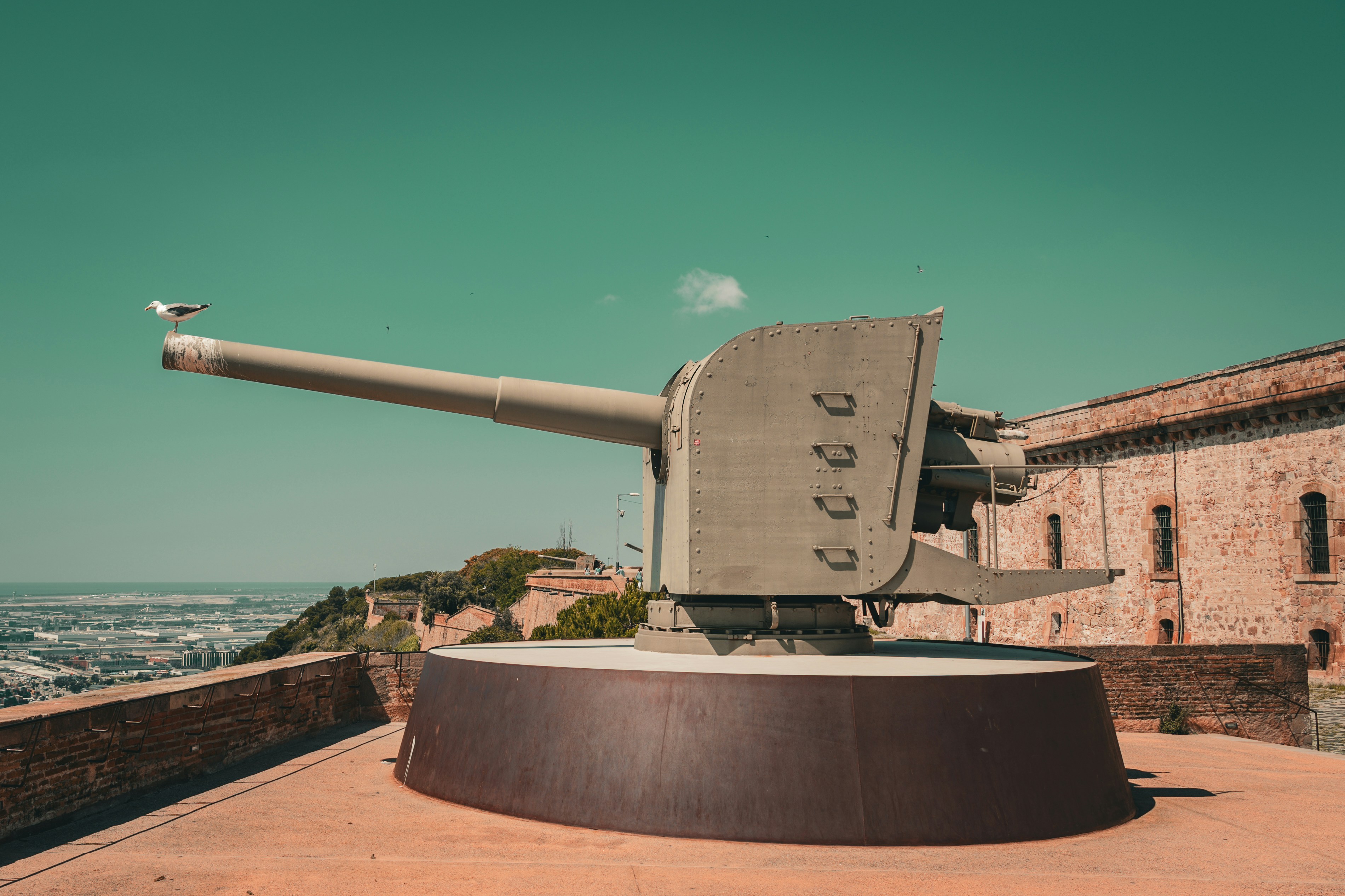 A large tank sitting on top of a stone wall