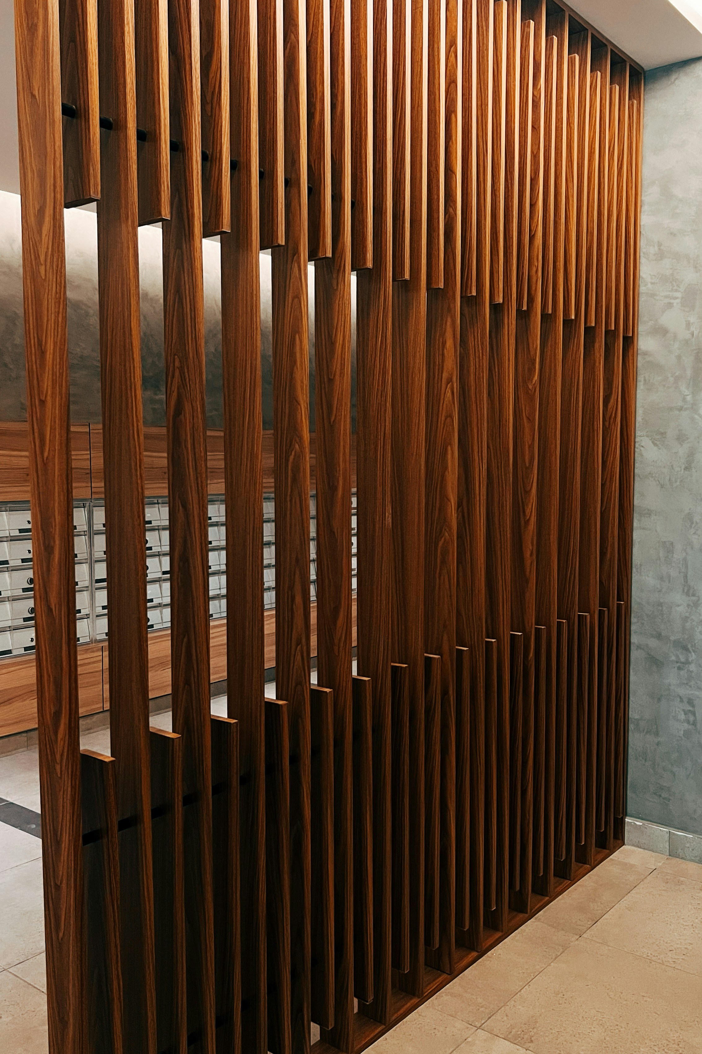A room with a bunch of wooden slats on the wall