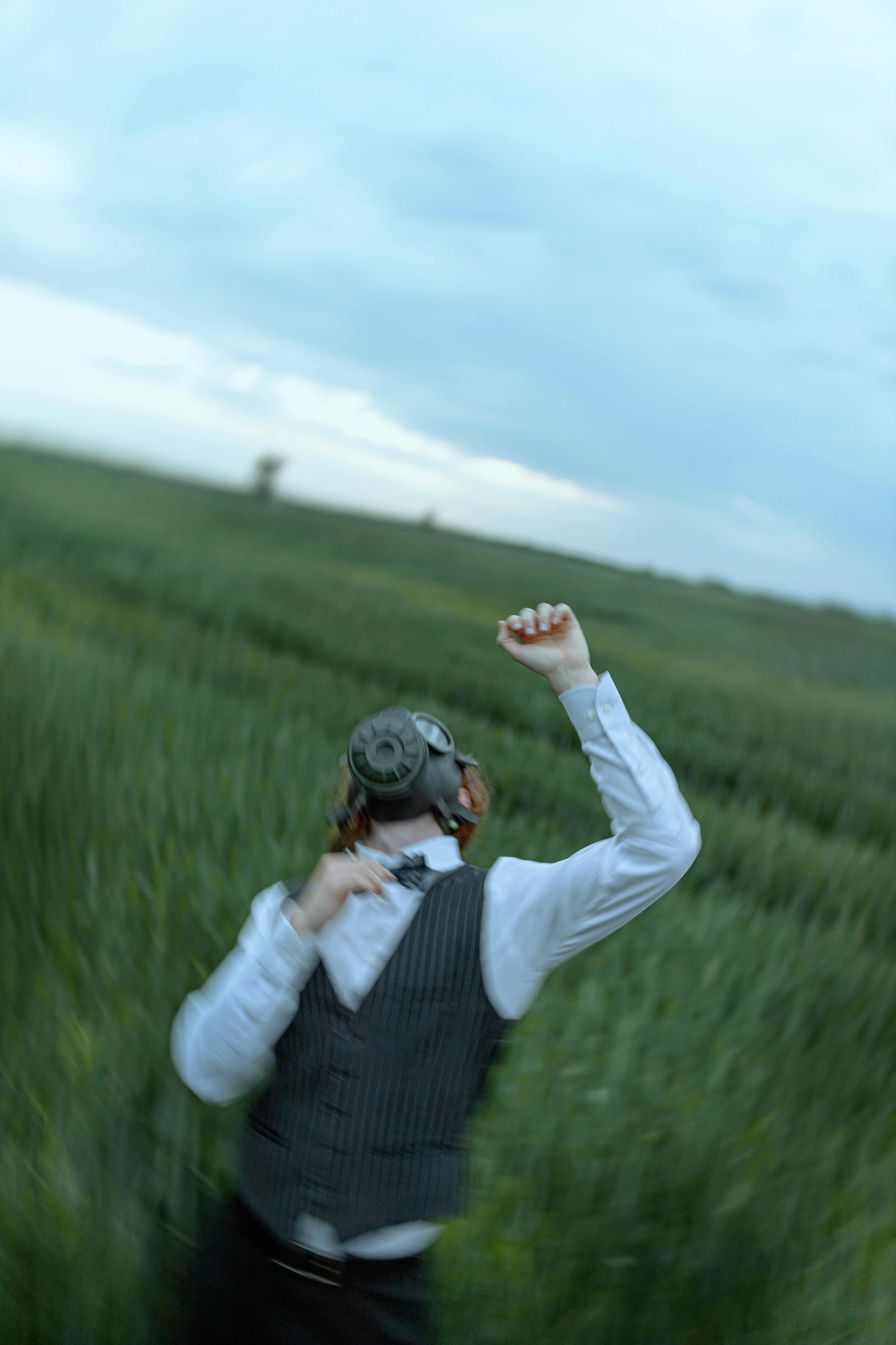 A man standing in a field of tall grass