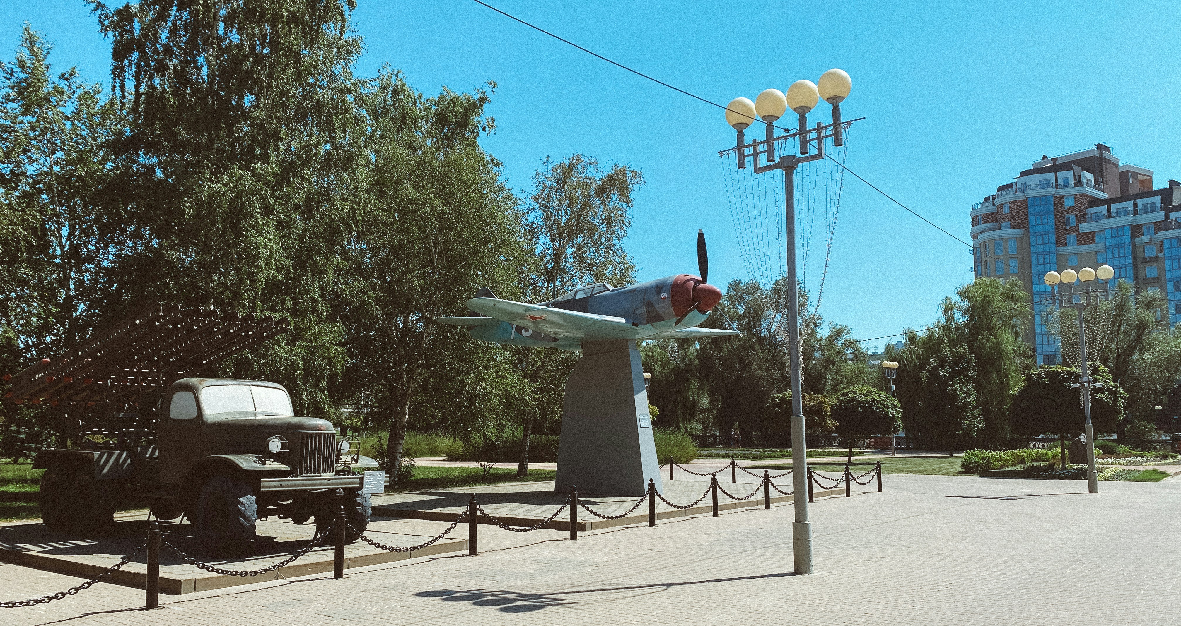 A black truck parked on the side of a road