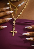 A woman wearing a necklace with a cross on it