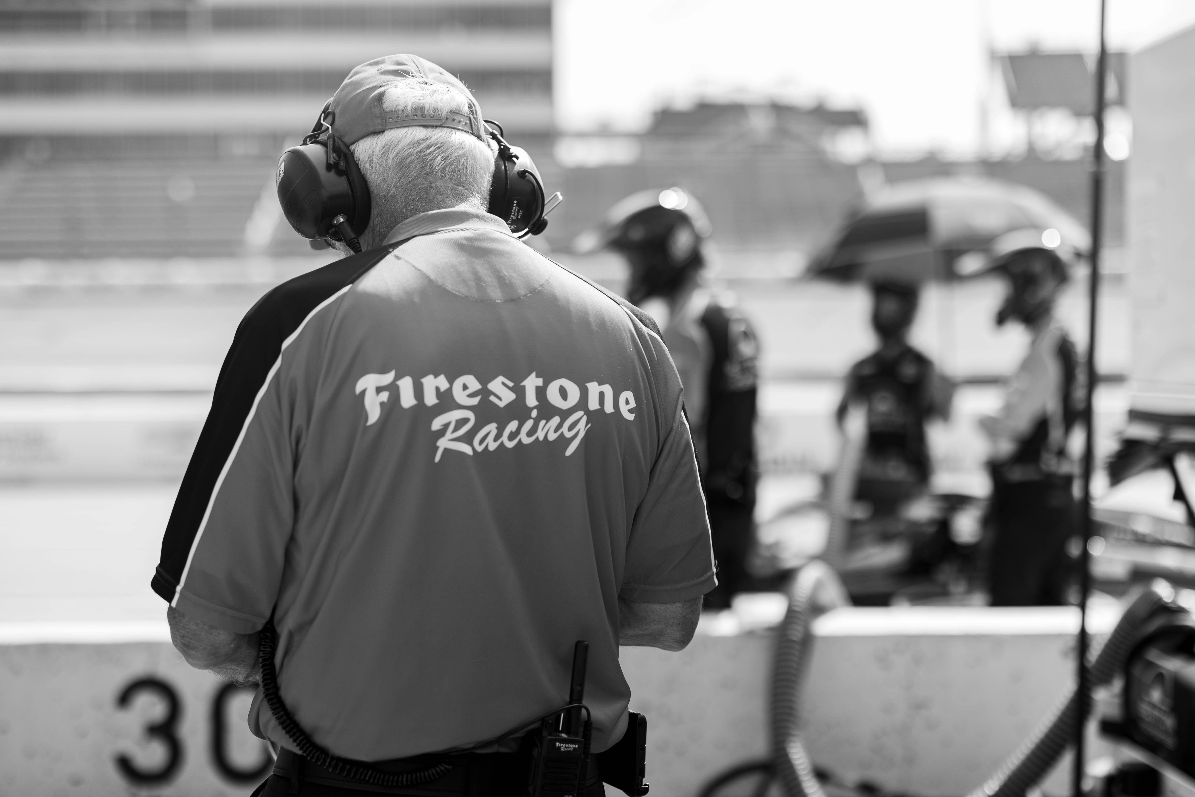 A black and white photo of a firefighter