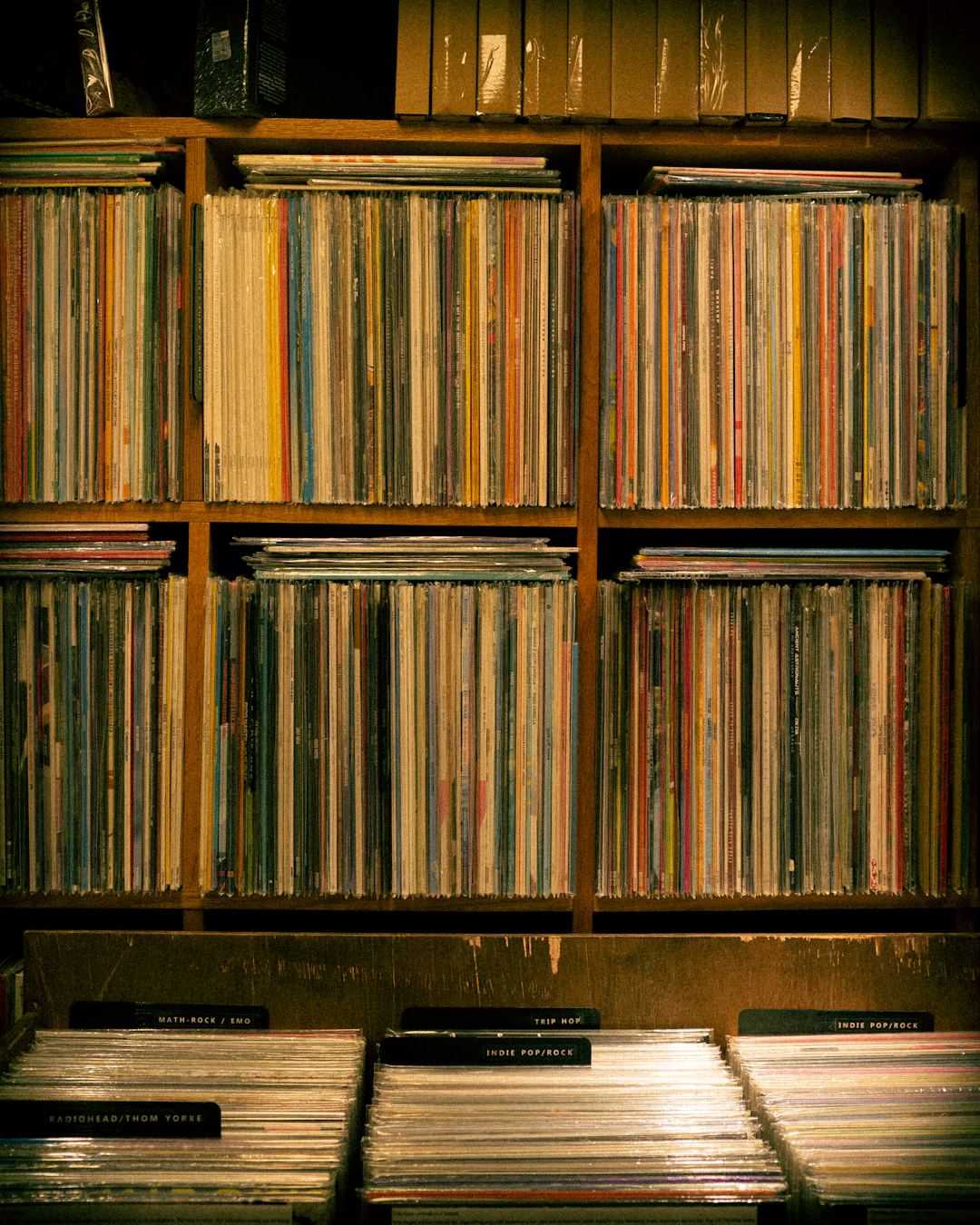A shelf filled with vinyl records