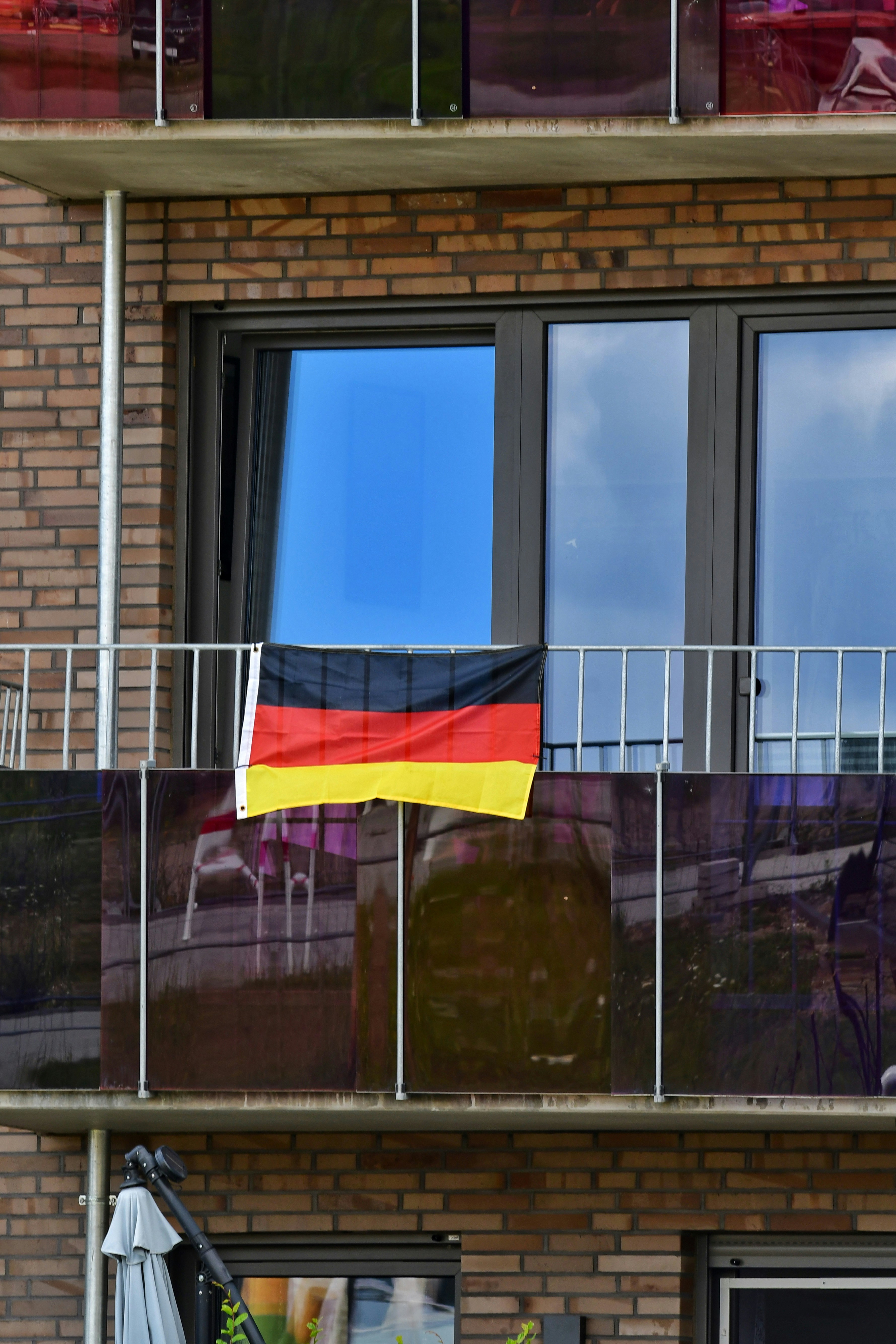 A building with a flag hanging from the balcony