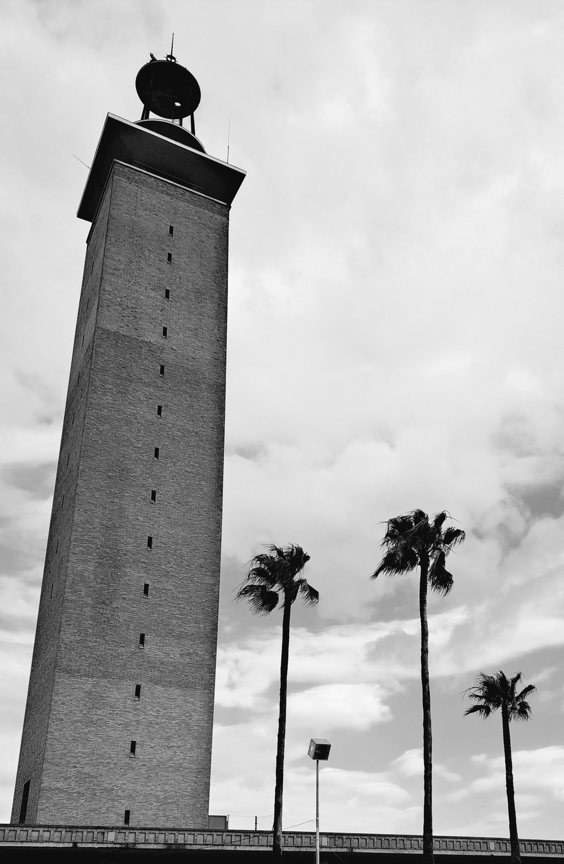 A black and white photo of a clock tower