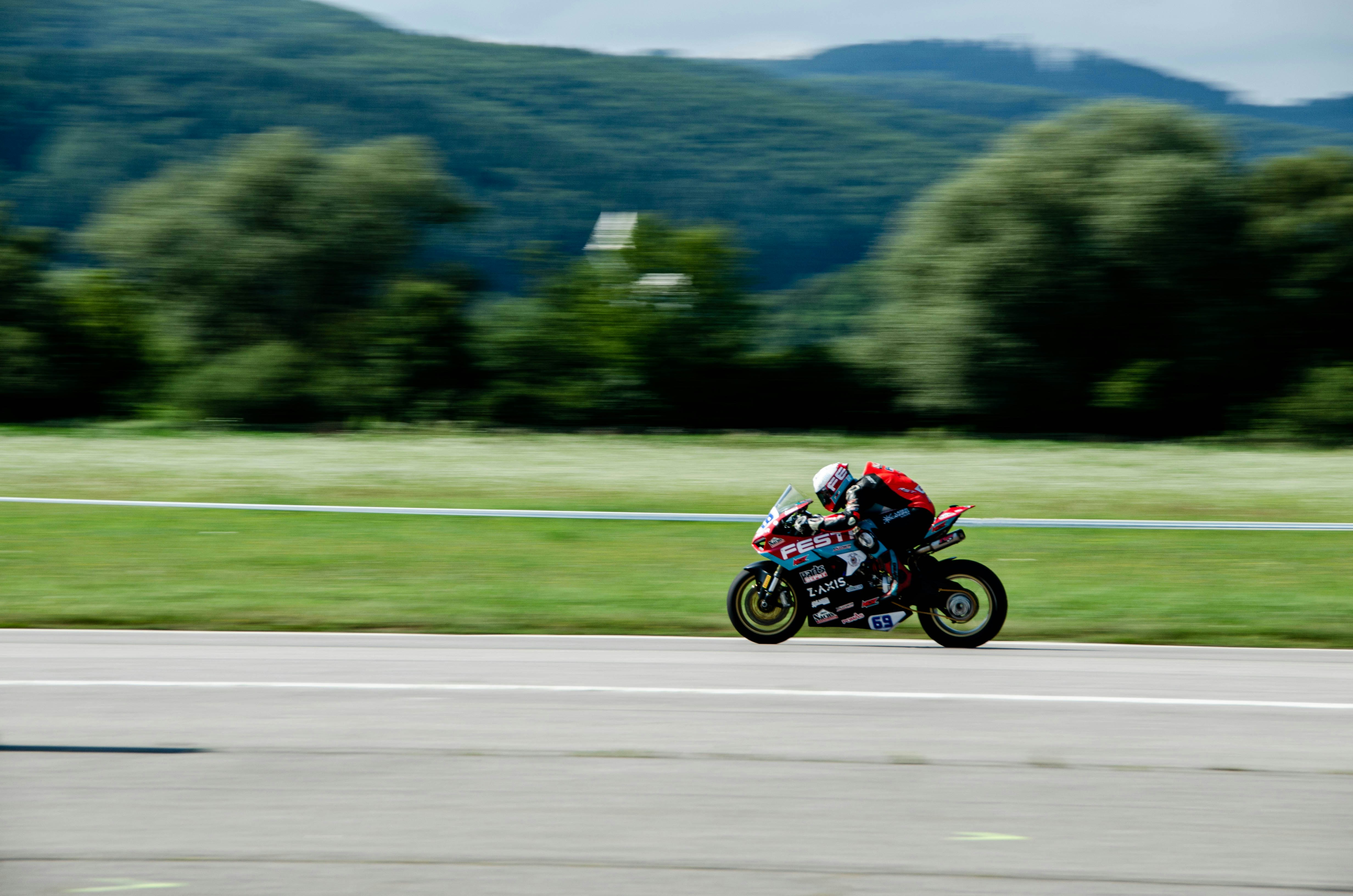A man riding a motorcycle down a curvy road