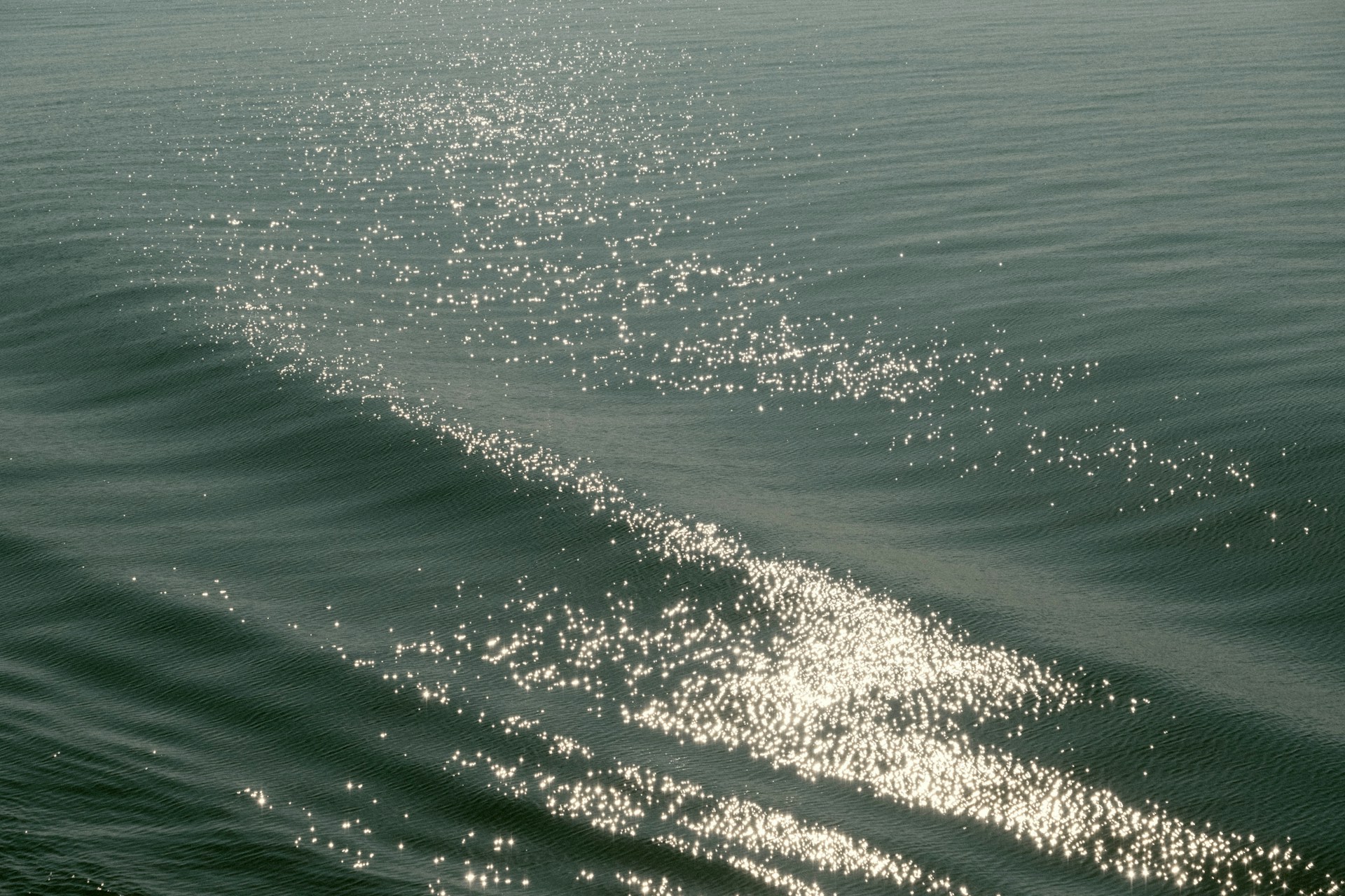 A body of water with a boat in the distance
