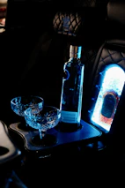 A bottle of wine and two glasses on a table