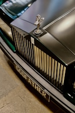 A close up of the front of a black car