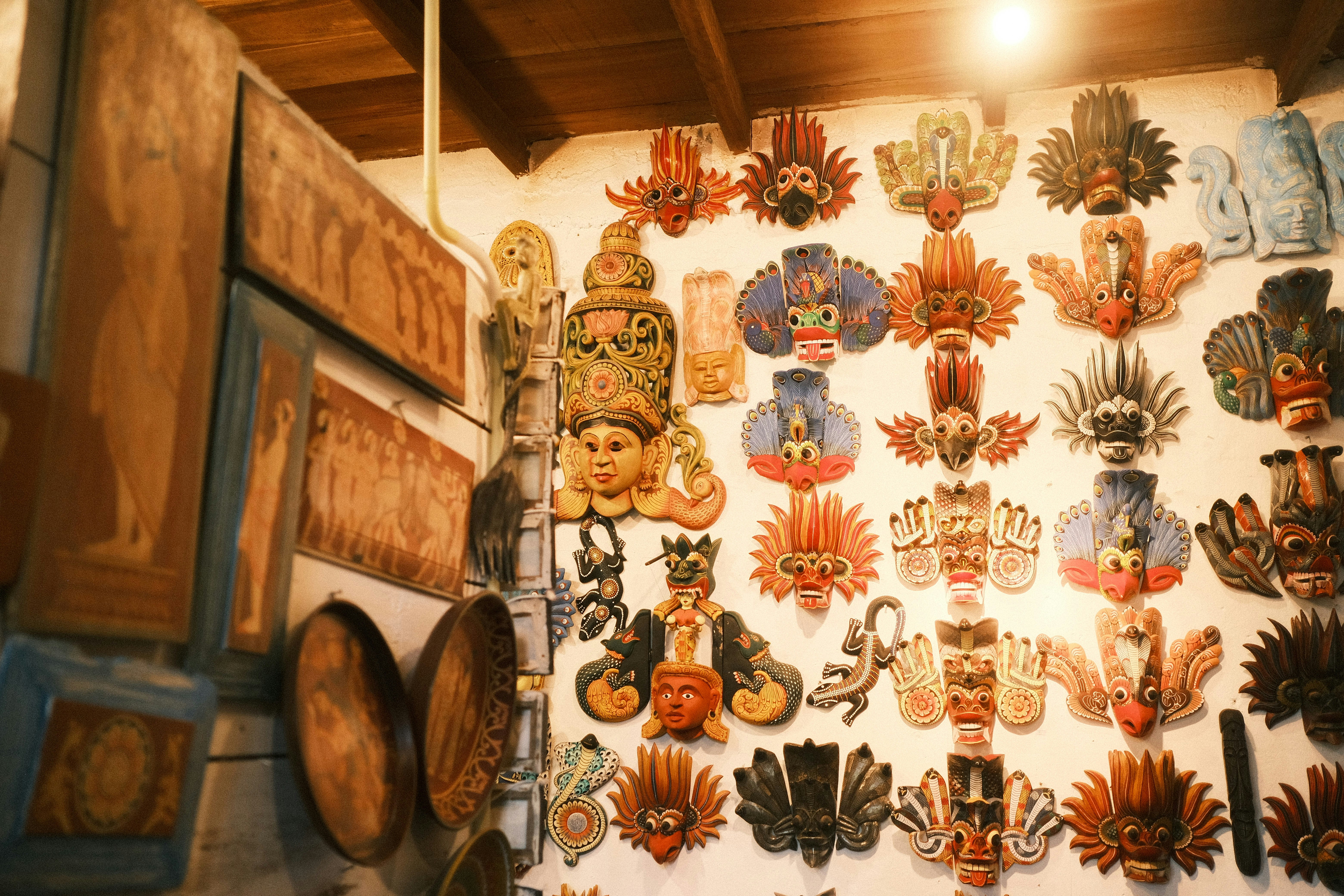 A wall covered in lots of different types of masks