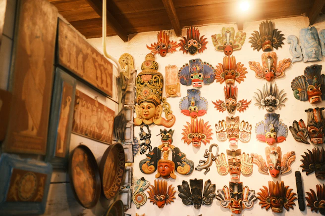 A wall covered in lots of different types of masks