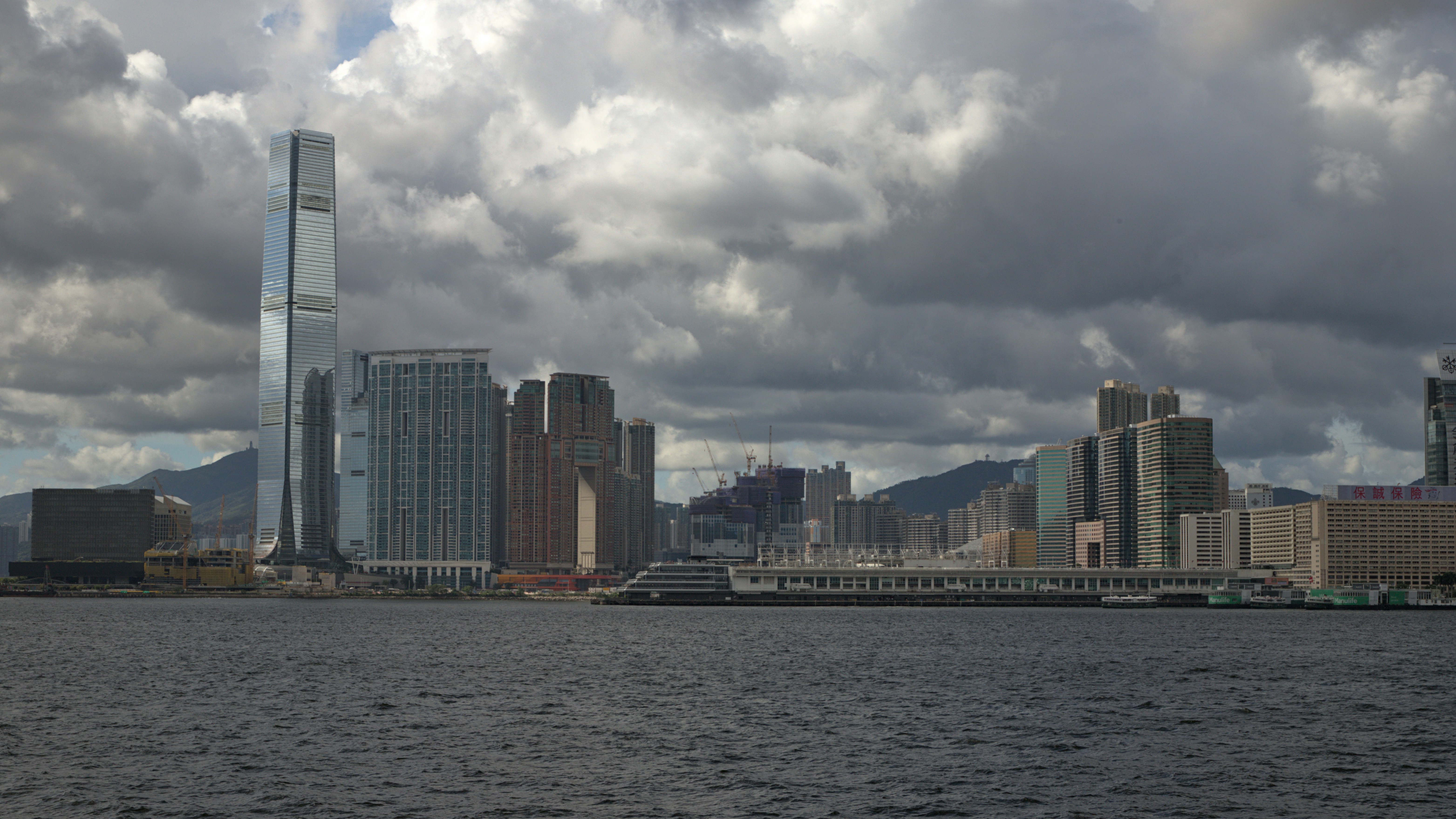 A large body of water with a city in the background