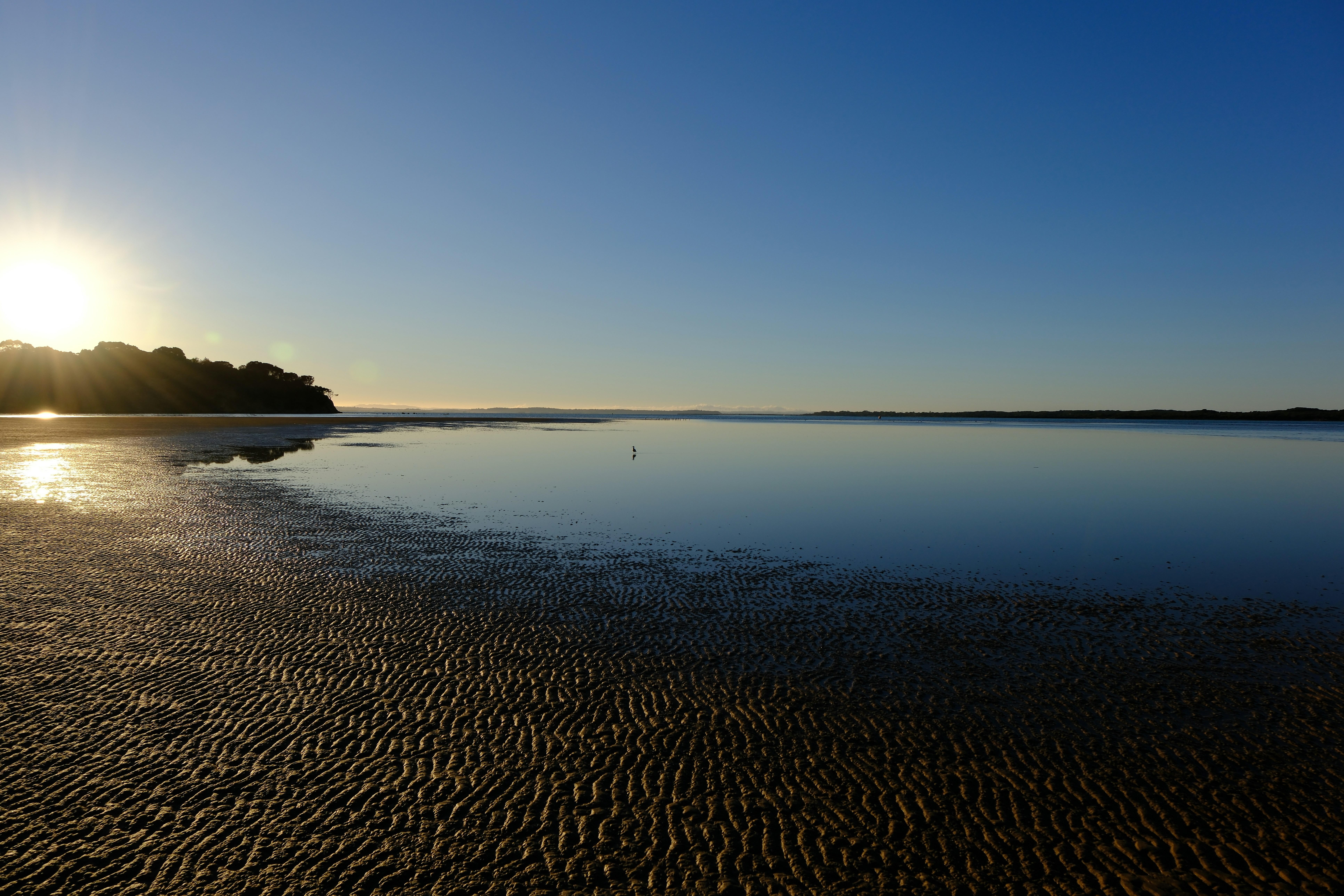 Serene view of Keawakapu Beach with golden sands and clear waters