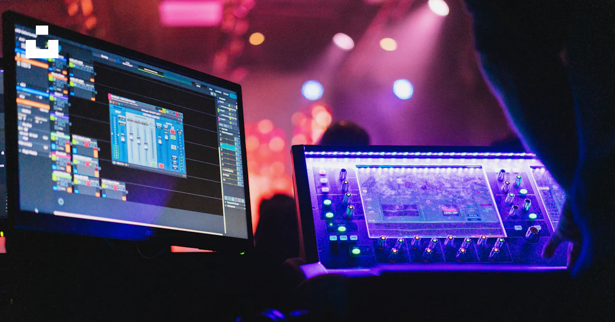 A person sitting in front of two computer monitors photo – Free Church ...