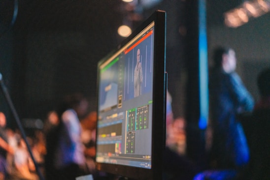 A computer monitor sitting on top of a desk