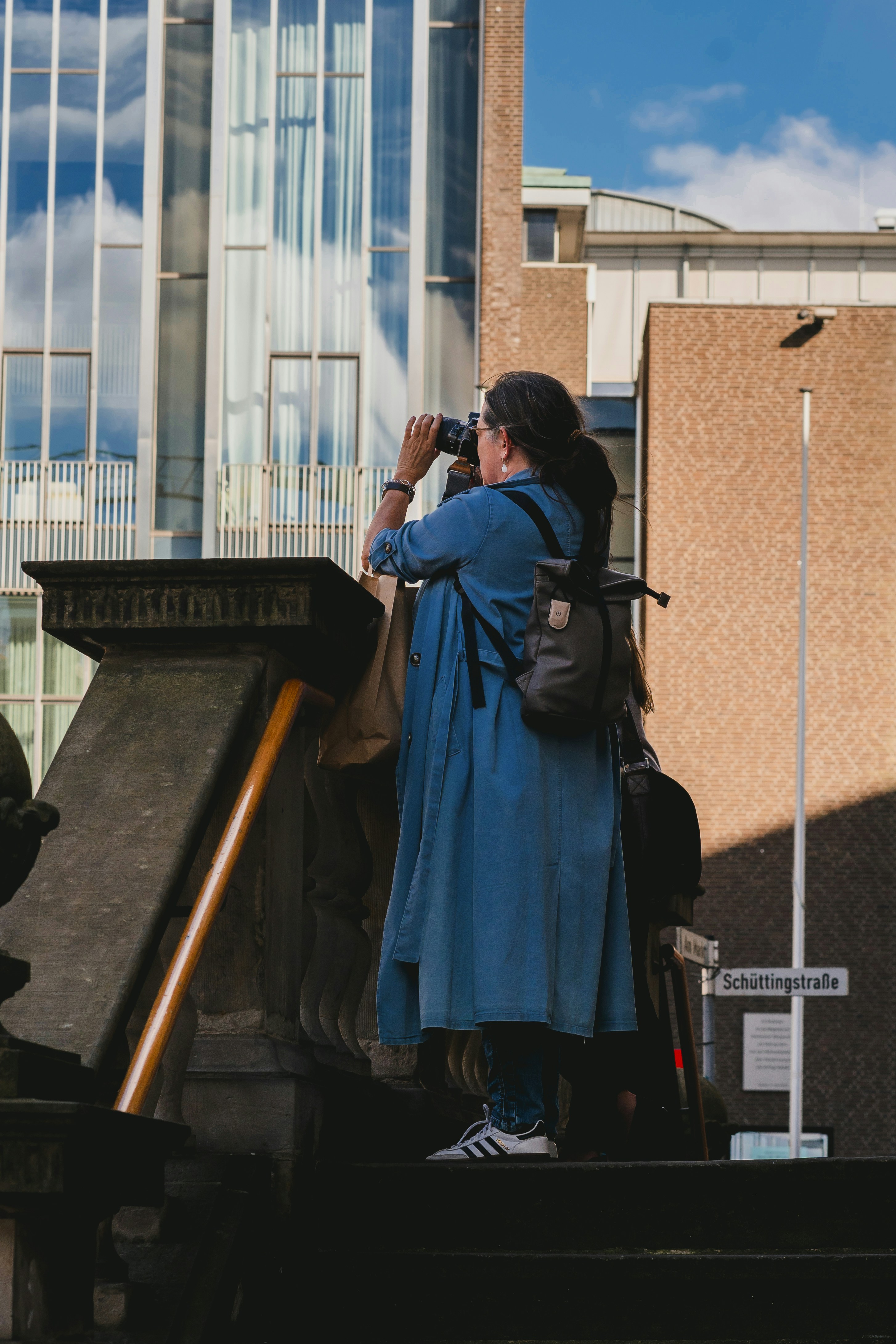 A person taking a picture of a building