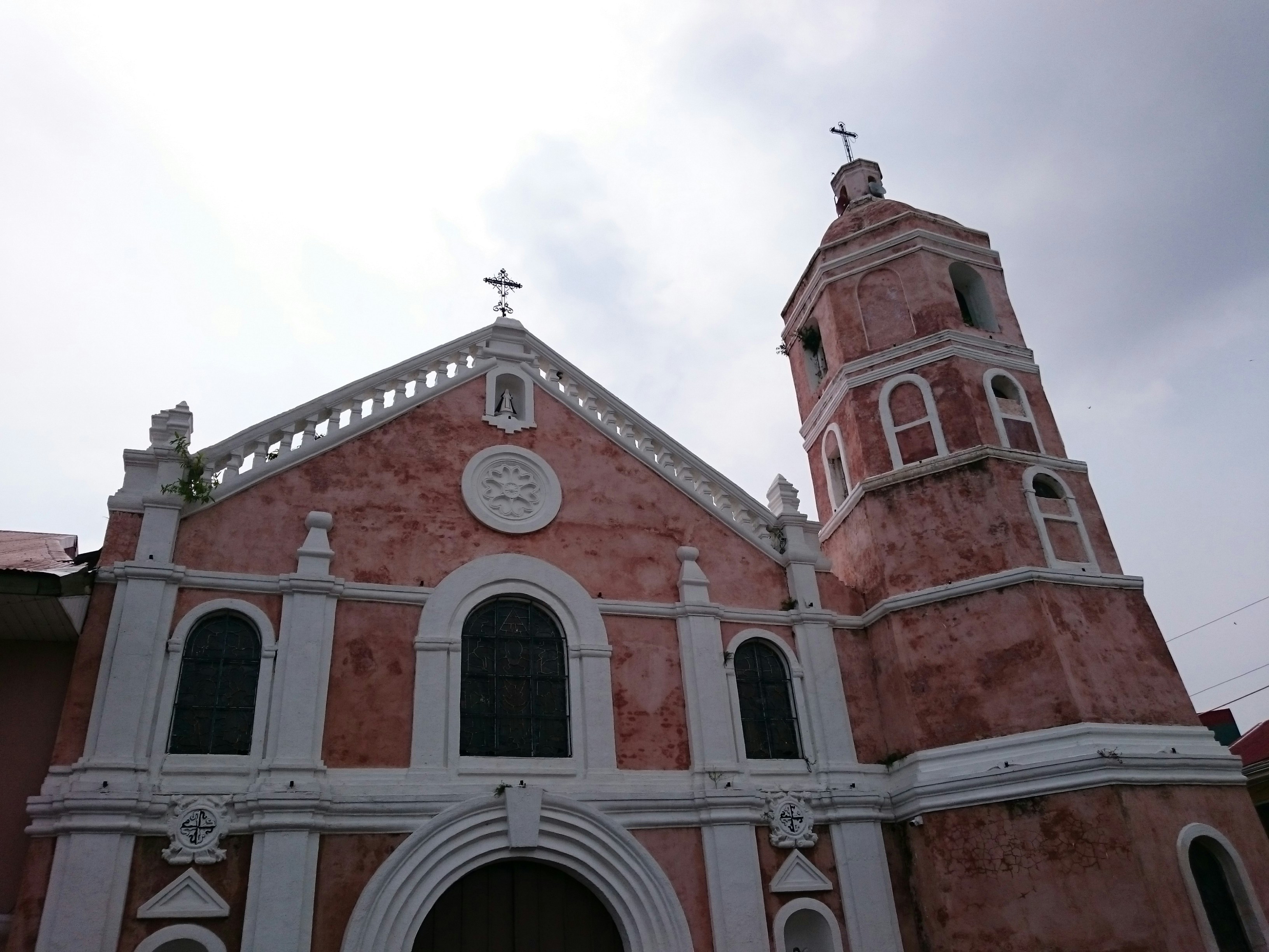 A church with a clock on the front of it