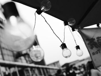 A black and white photo of a street light