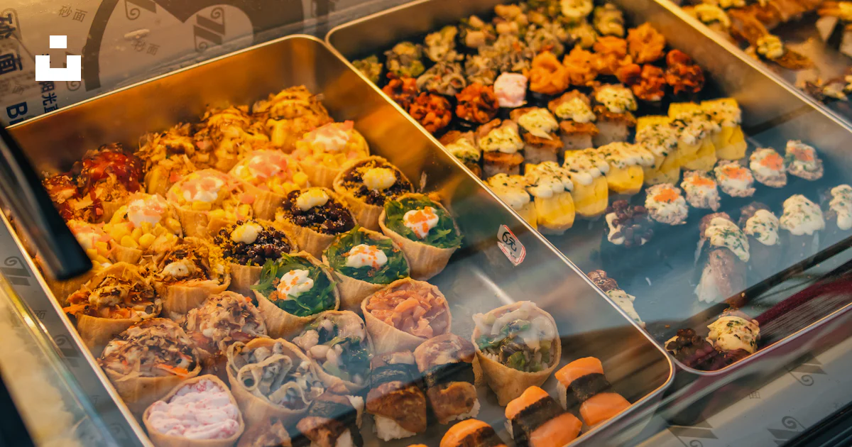 A display case filled with lots of different types of food photo – Free ...