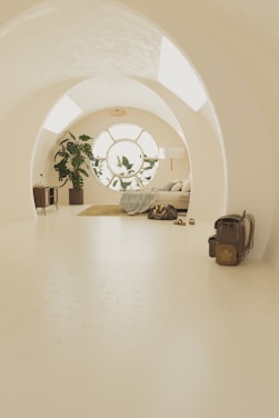 A white room with a bed and a window