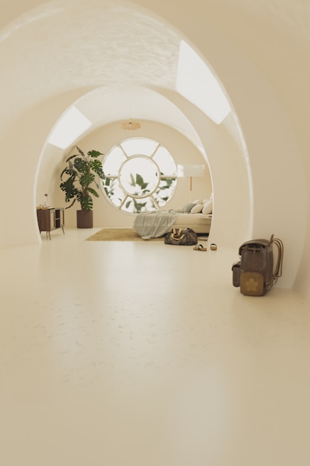 A white room with a bed and a window