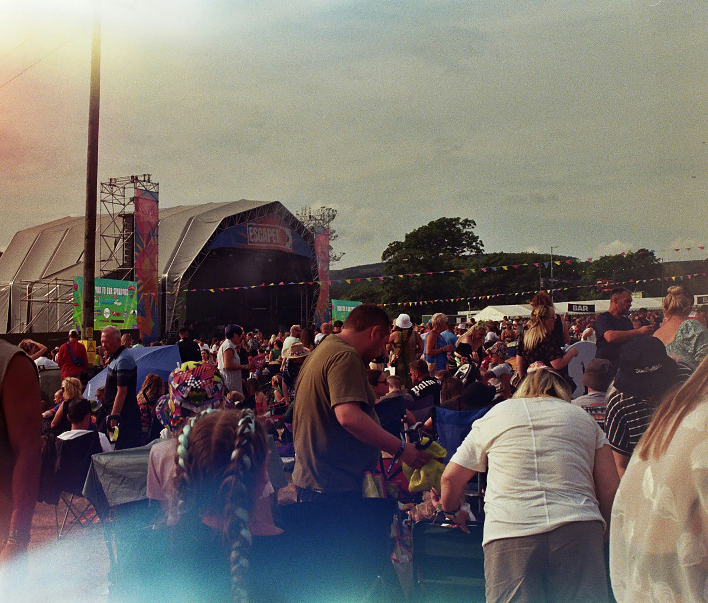 A crowd of people standing around a stage