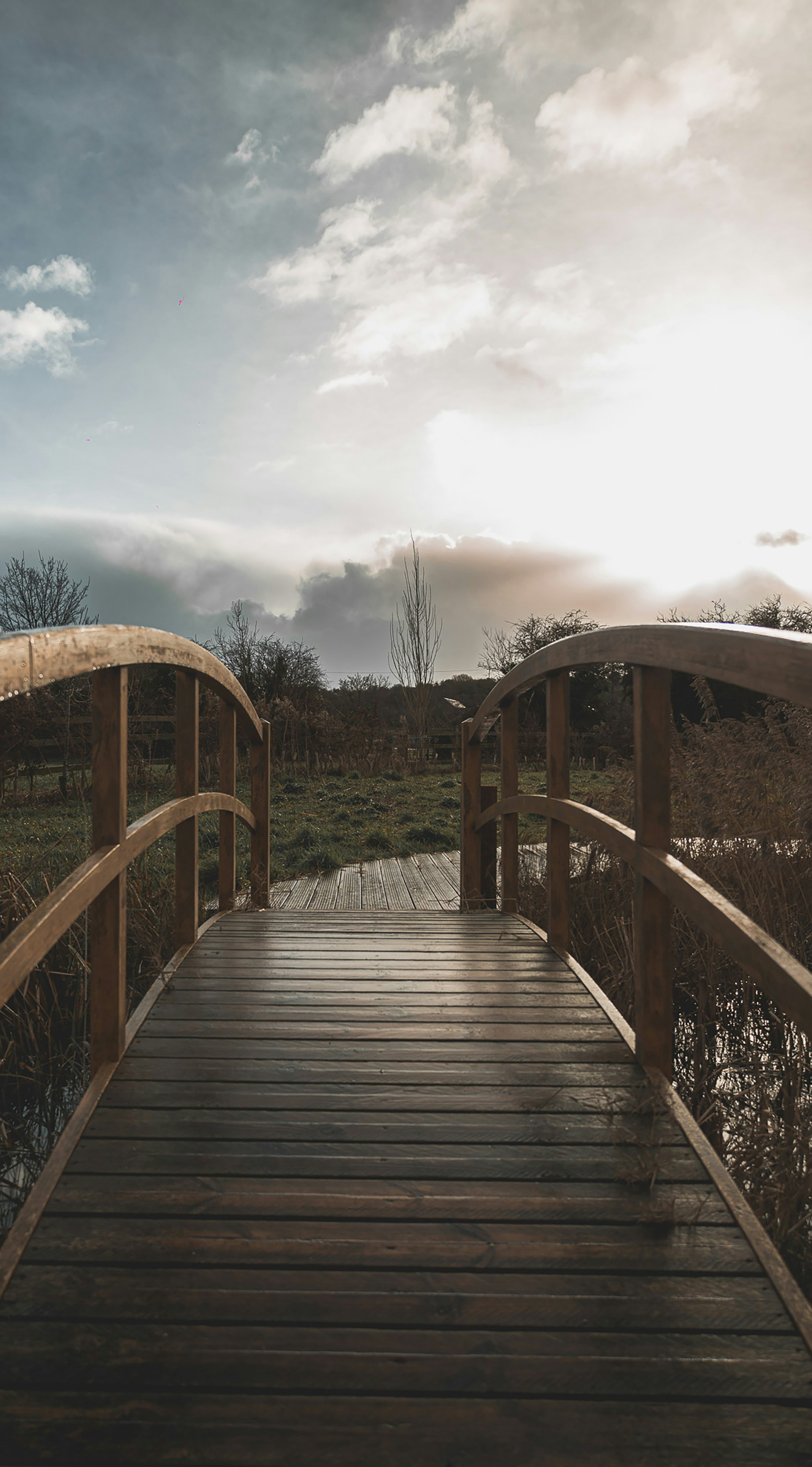A wooden bridge over a body of water