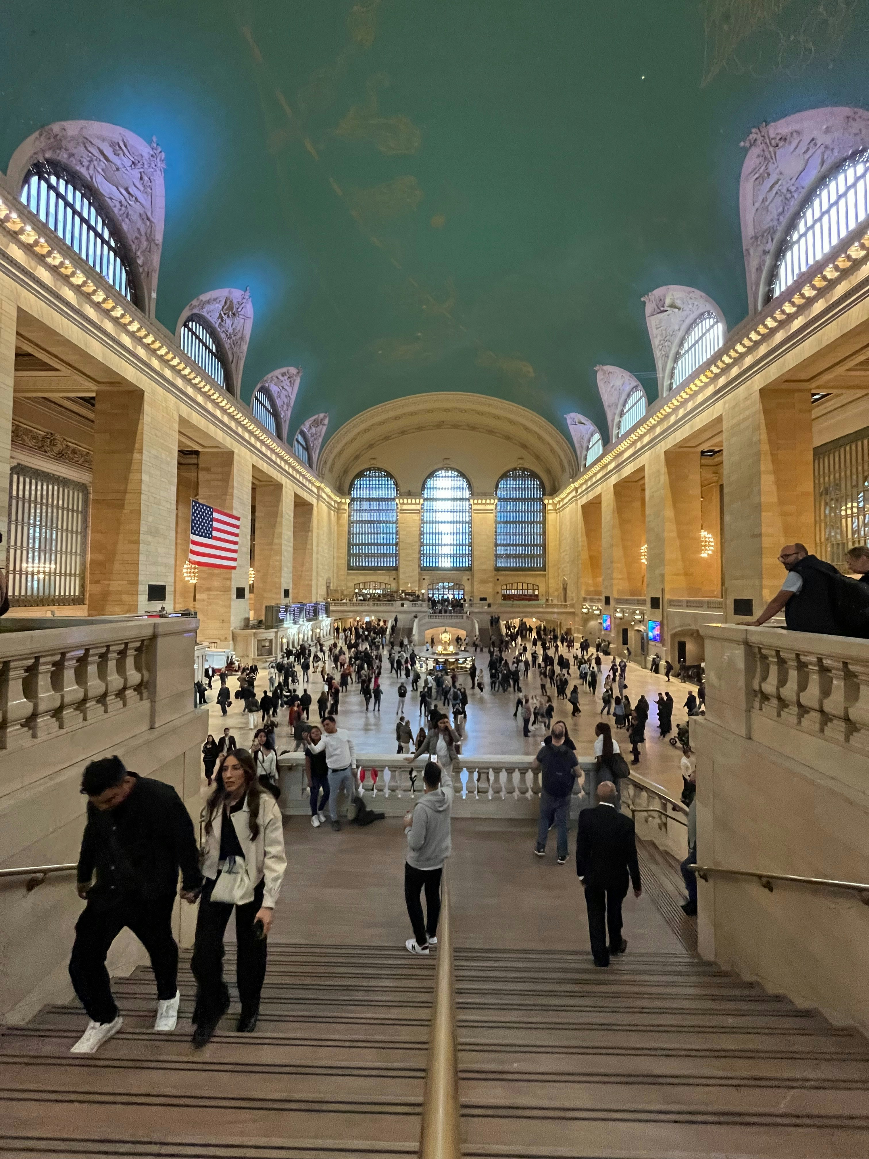 A group of people walking up and down a flight of stairs