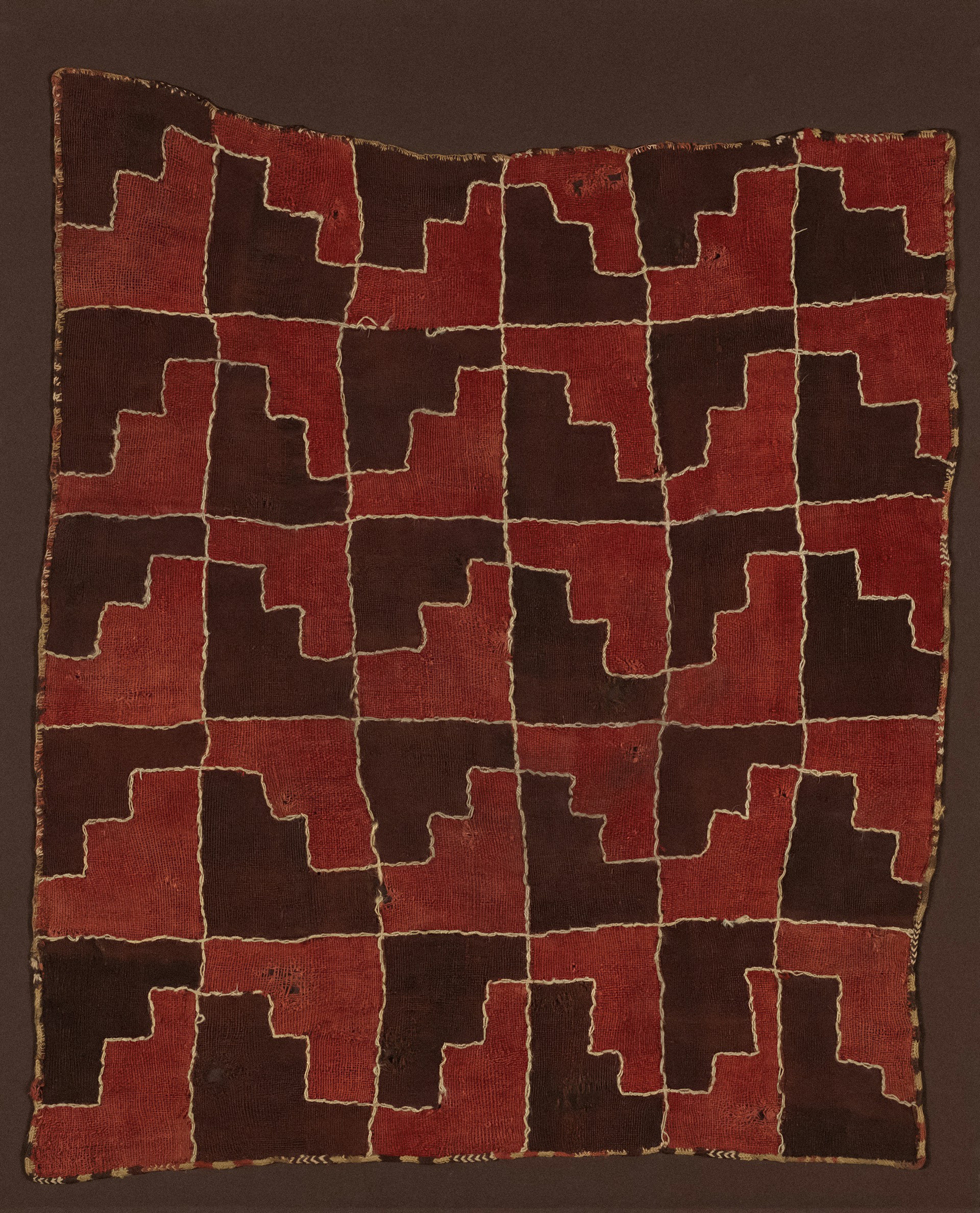 a close up of a metal surface with a clock on it