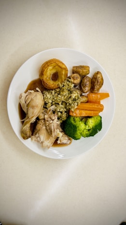 A white plate topped with different types of food