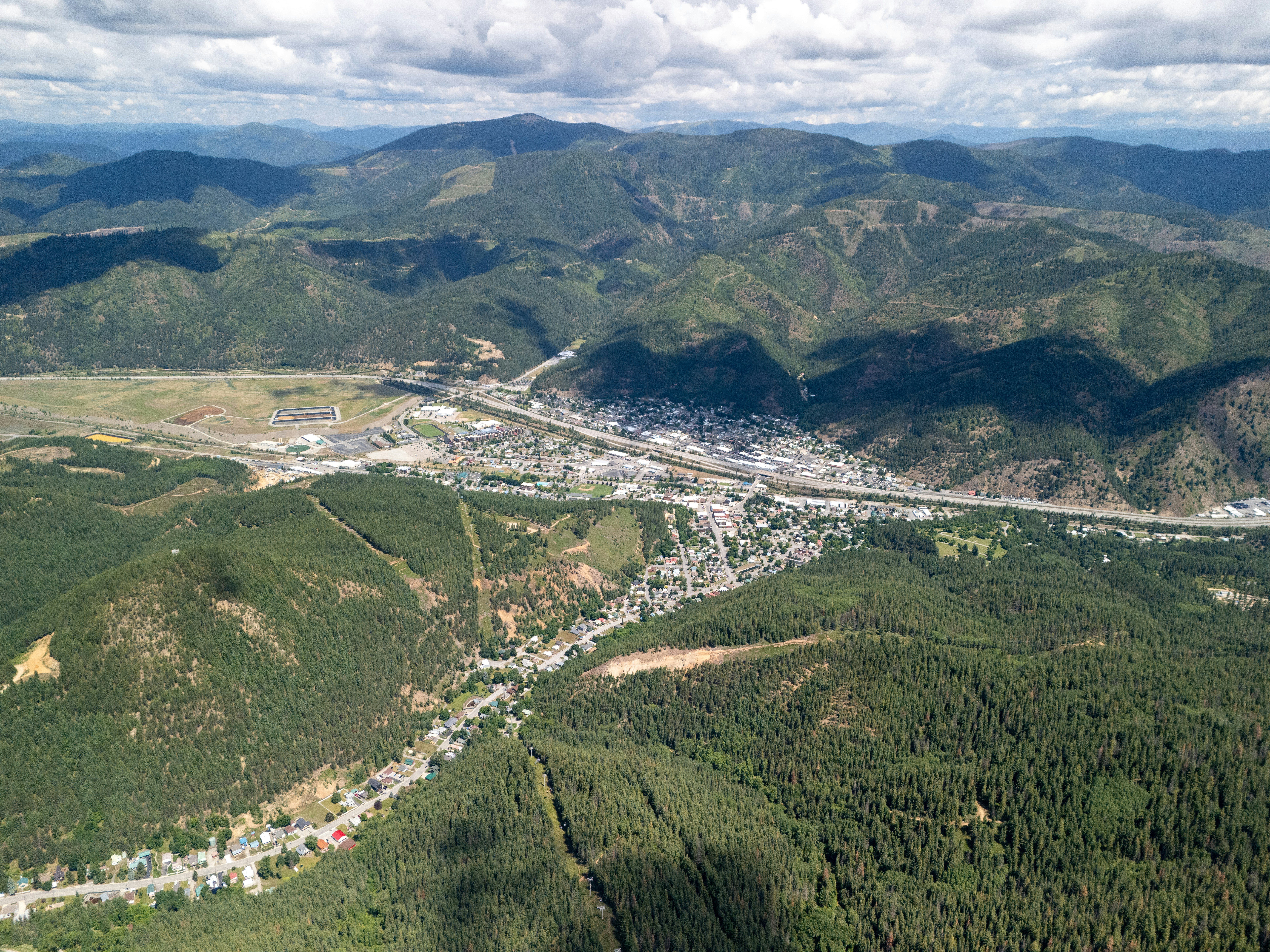 An aerial view of a city and mountains