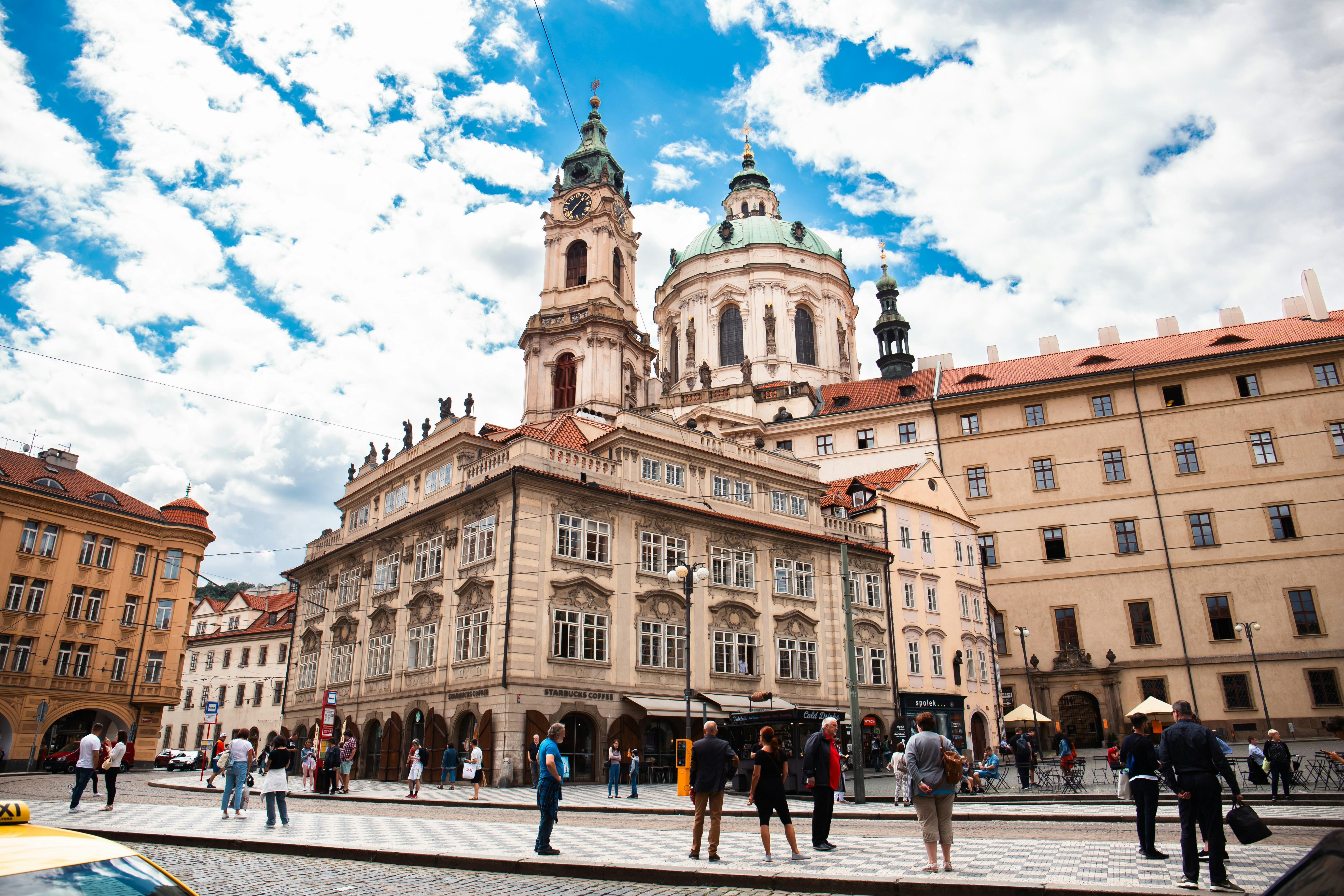 A group of people standing in front of a building