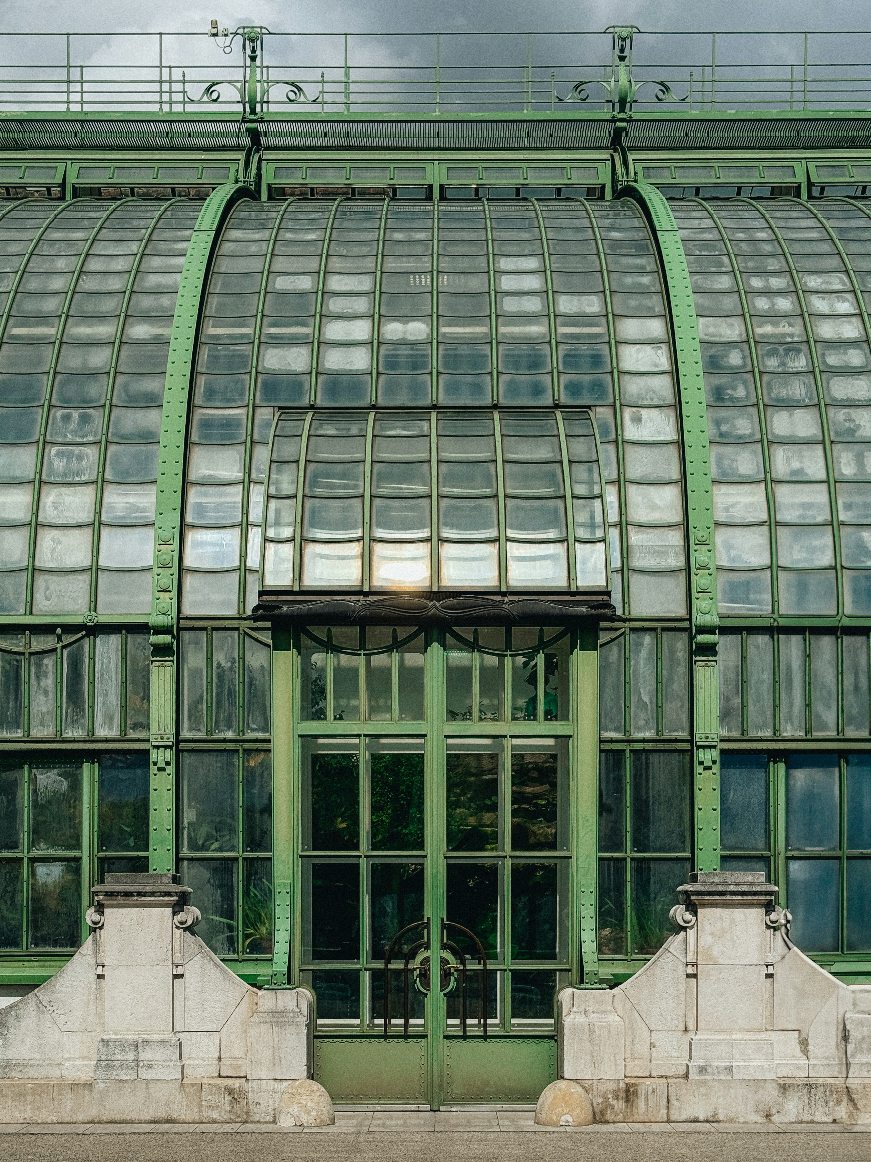 A large green building with a lot of windows