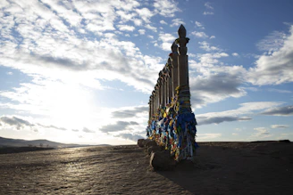 A very tall building sitting in the middle of a desert