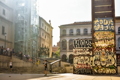 A person riding a skateboard down a set of stairs