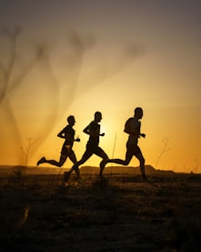 A couple of people that are running in the dirt