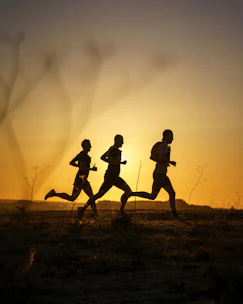 A couple of people that are running in the dirt
