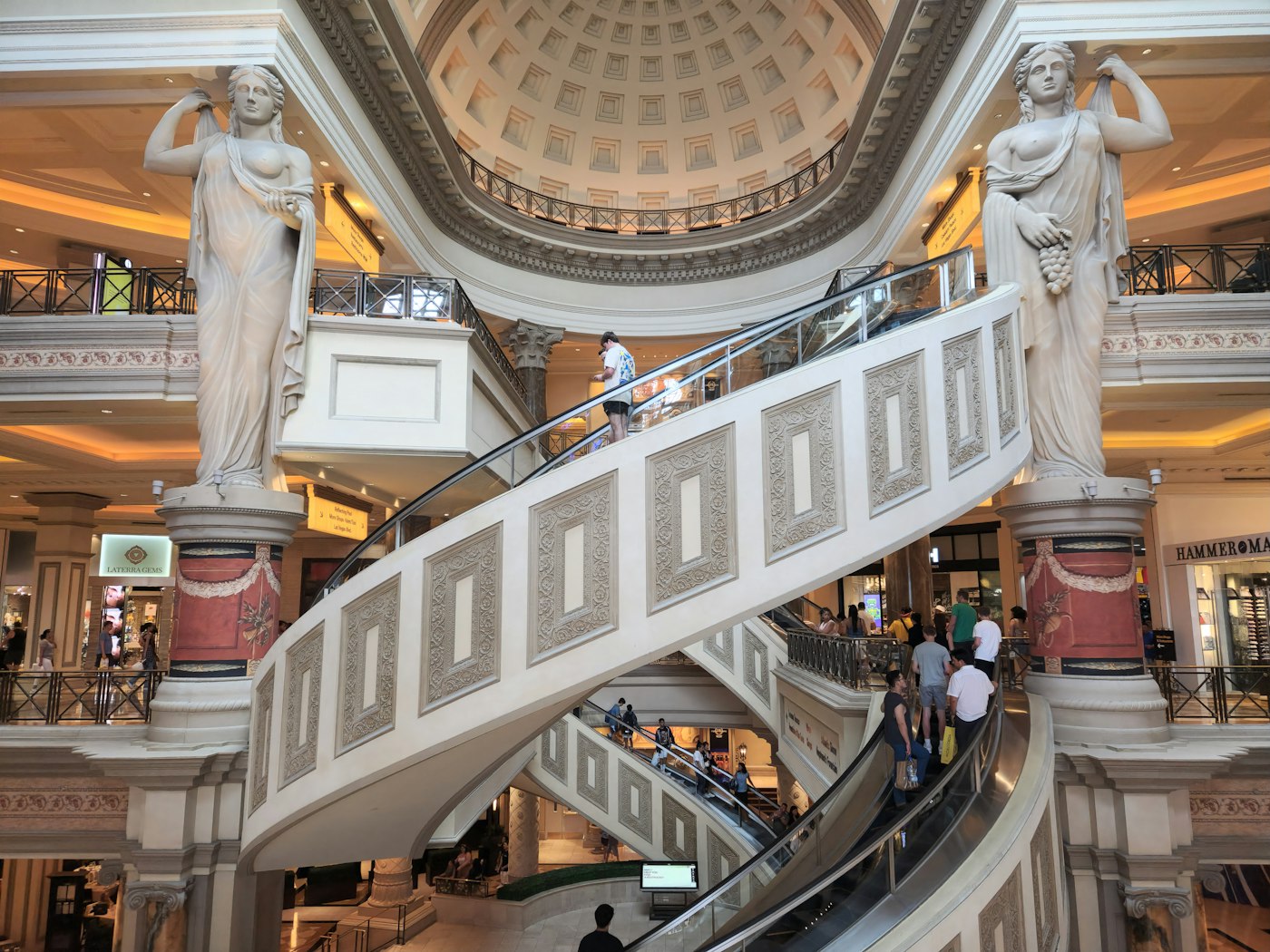 People walking through a shopping mall, representing global retail presence