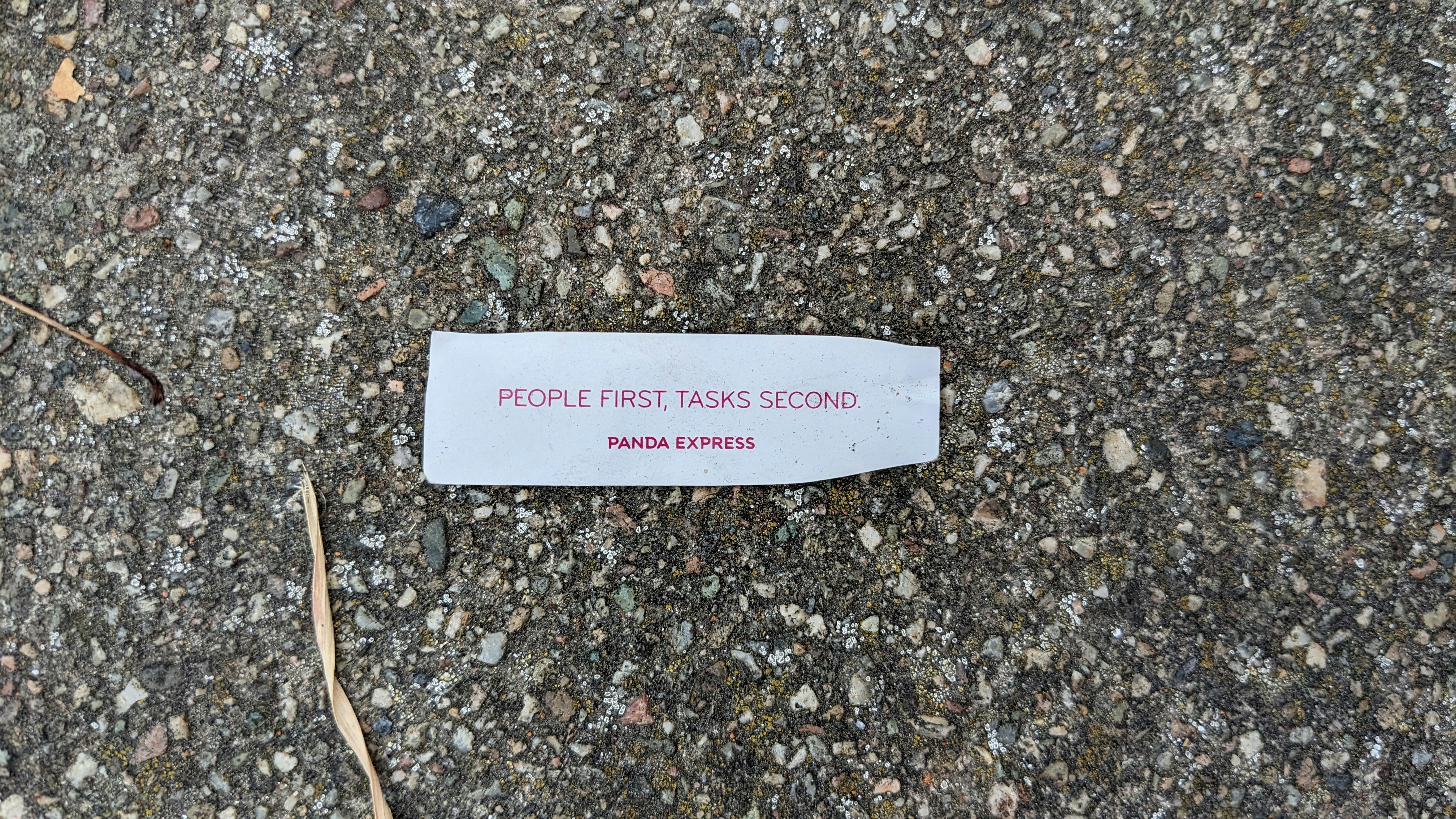 A piece of paper that is laying on the ground