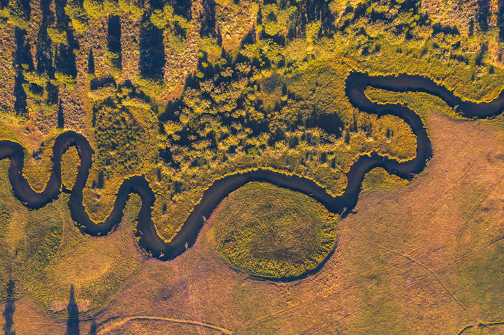 An aerial view of a river and land
