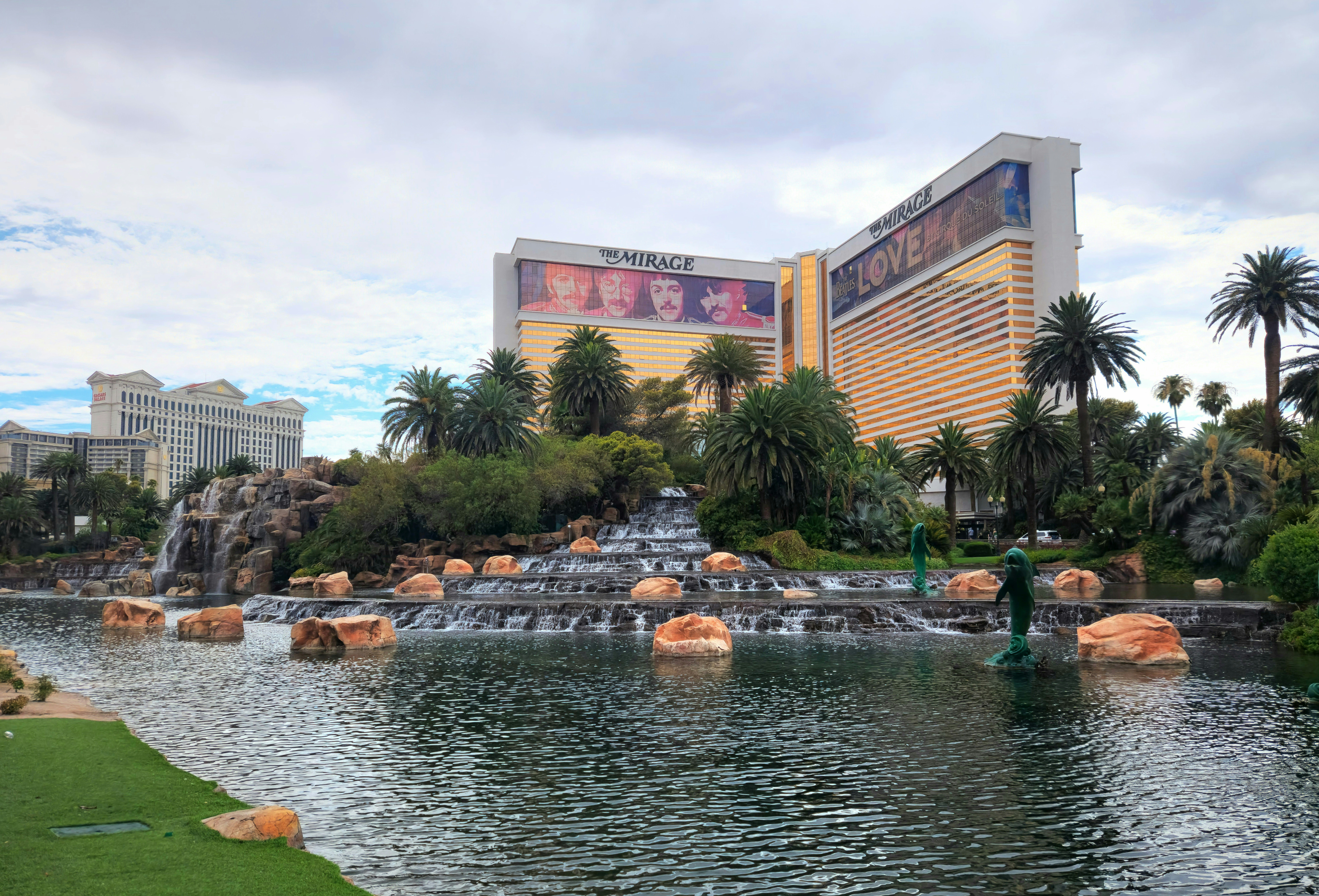 The Mirage Hotel in Las Vegas is a renowned luxury resort situated on the famous Las Vegas Strip. Known for its tropical theme and iconic volcano show, the hotel features lush gardens, a large pool area, and various entertainment options, including Siegfried & Roy's Secret Garden and Dolphin Habitat. The Mirage offers upscale dining with celebrity chef restaurants, a vibrant nightlife, and a casino, making it a premier destination for travelers seeking excitement and relaxation.