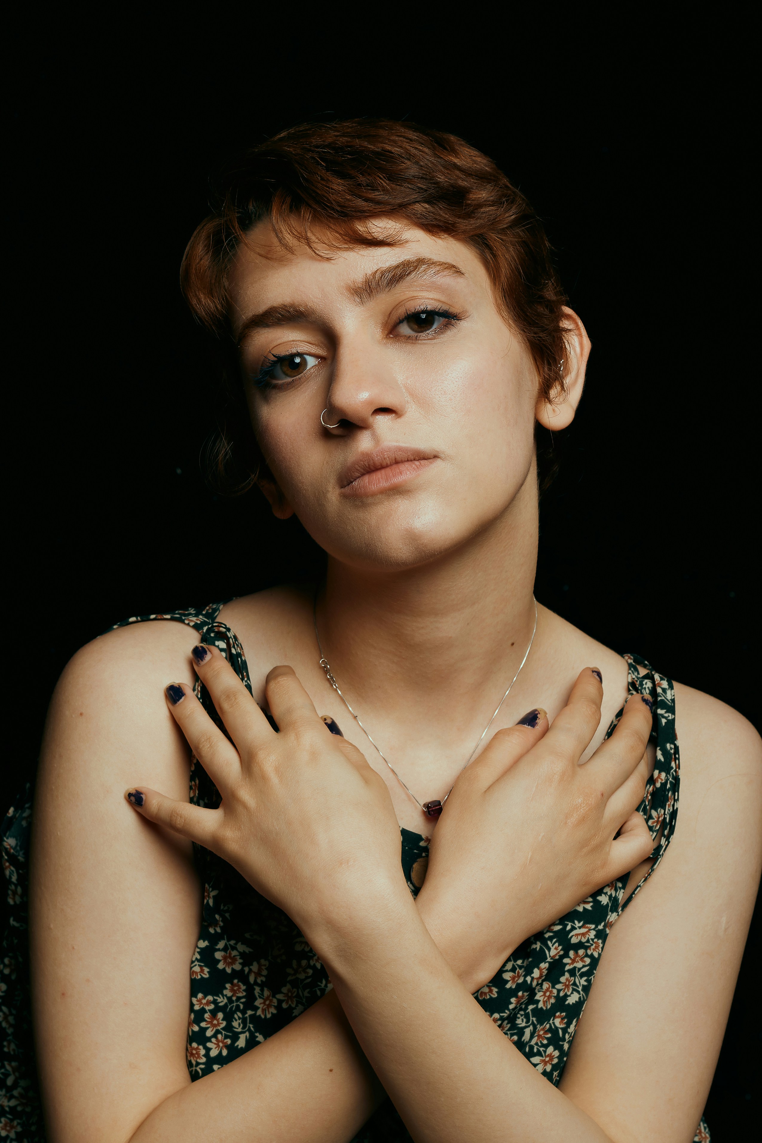 A woman with her hands on her chest