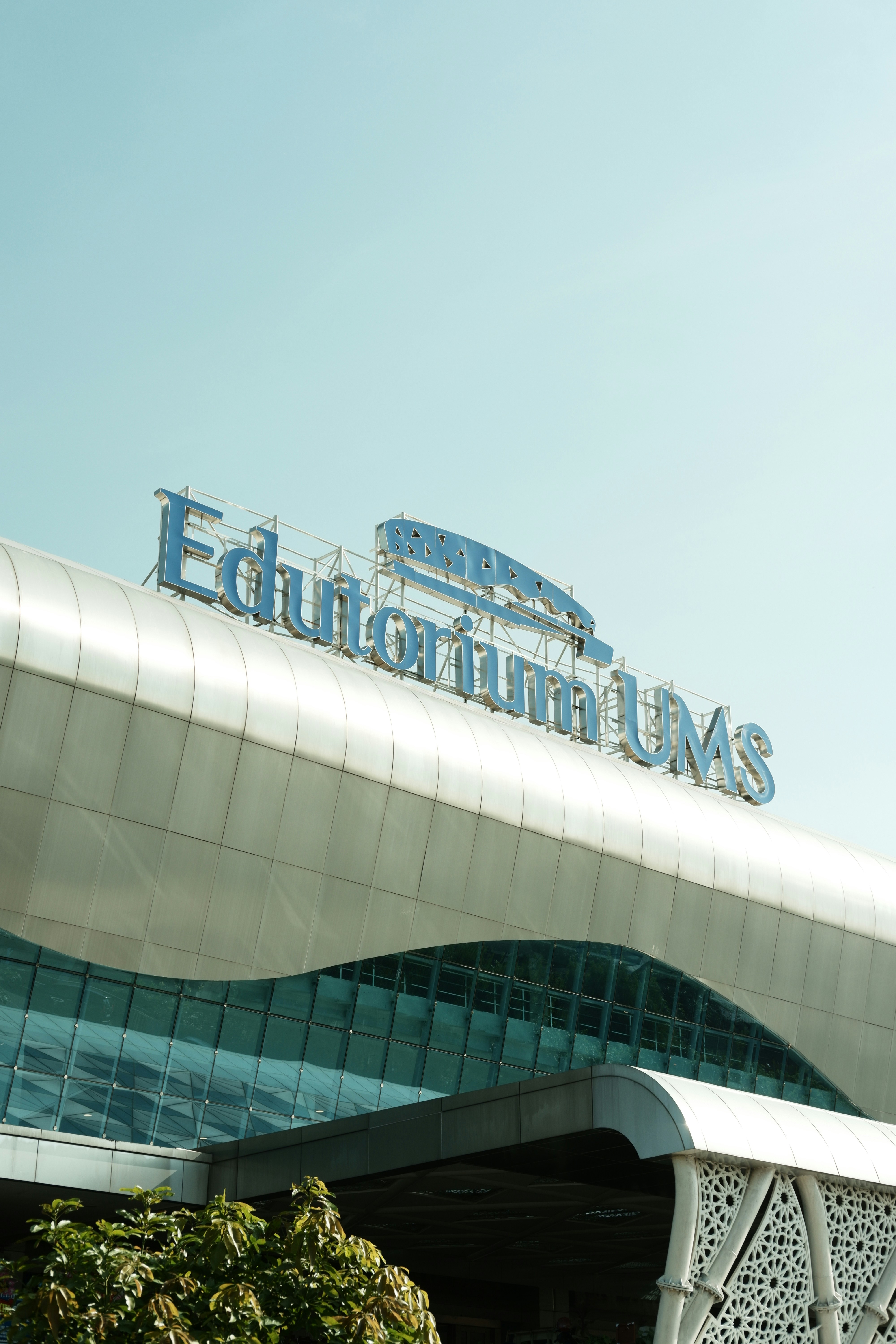 A large building with a sign on top of it