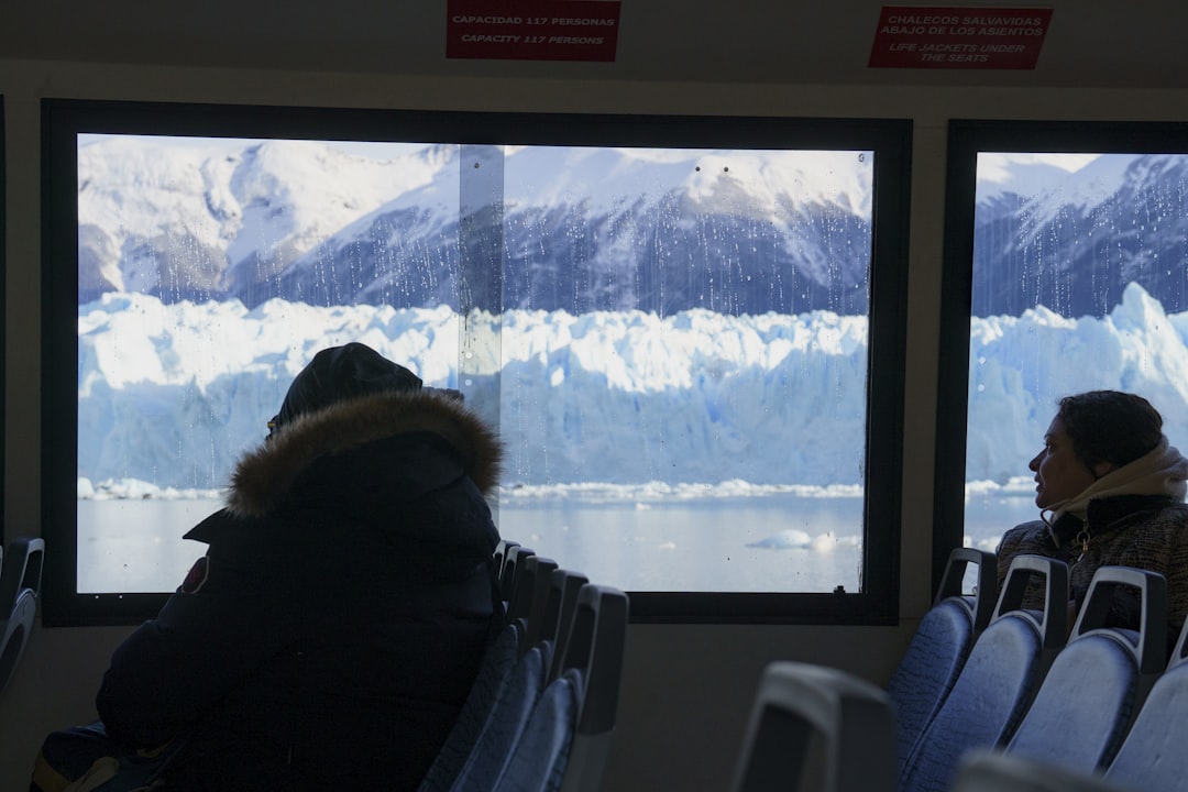 A couple of people that are sitting in a bus,