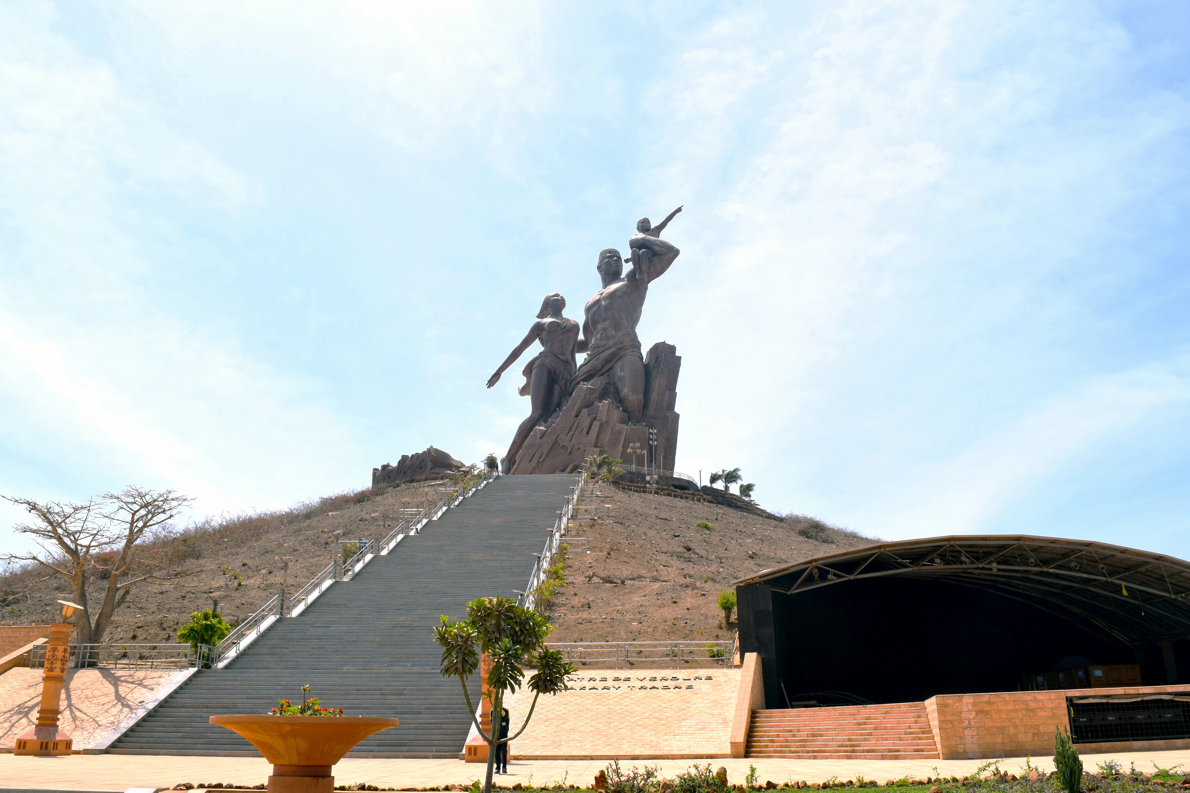 The bronze figures of the African Renaissance Monument towering over a long ceremonial staircase on the Mamelles hills of Dakar