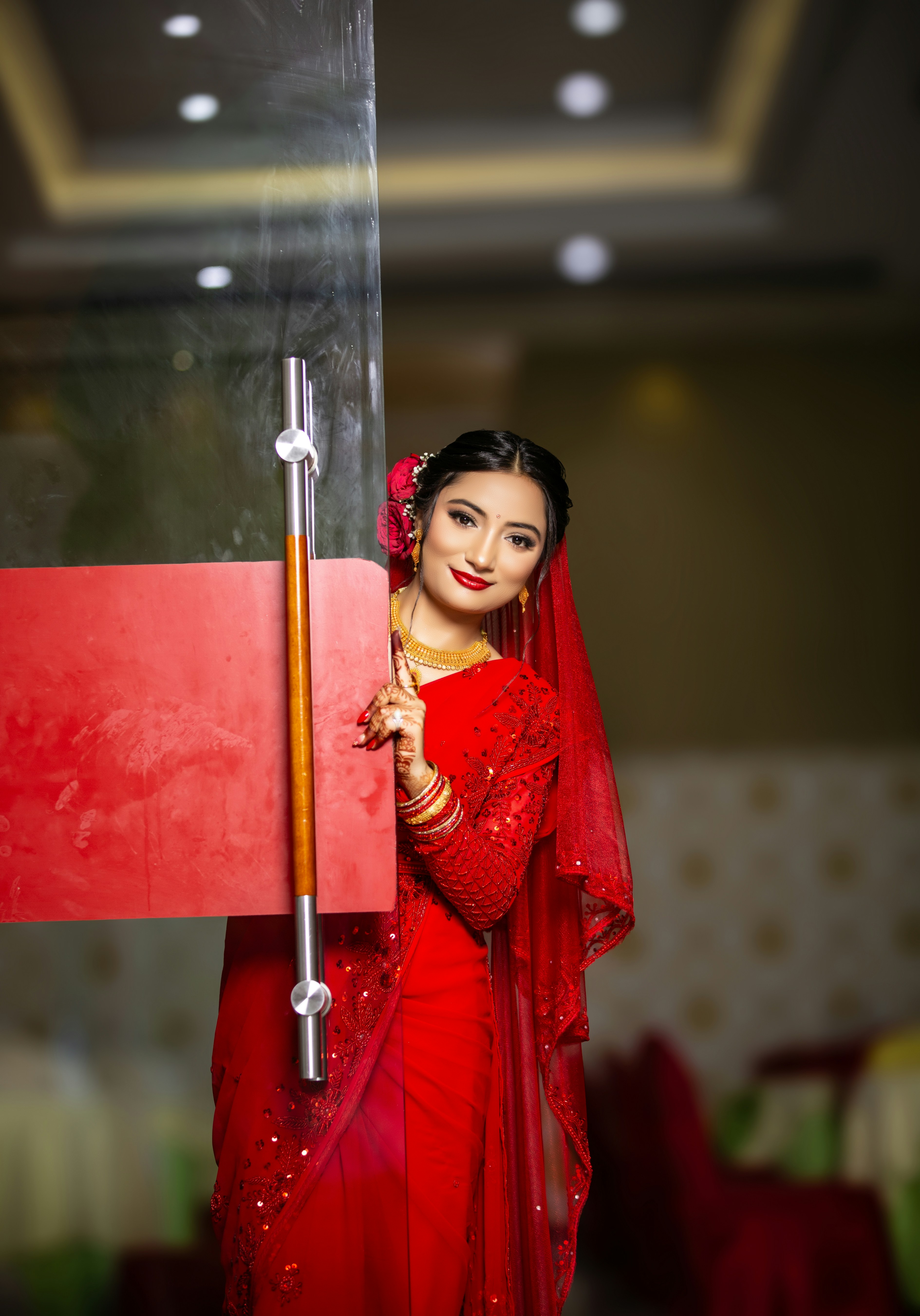 A woman in a red dress holding a red flag