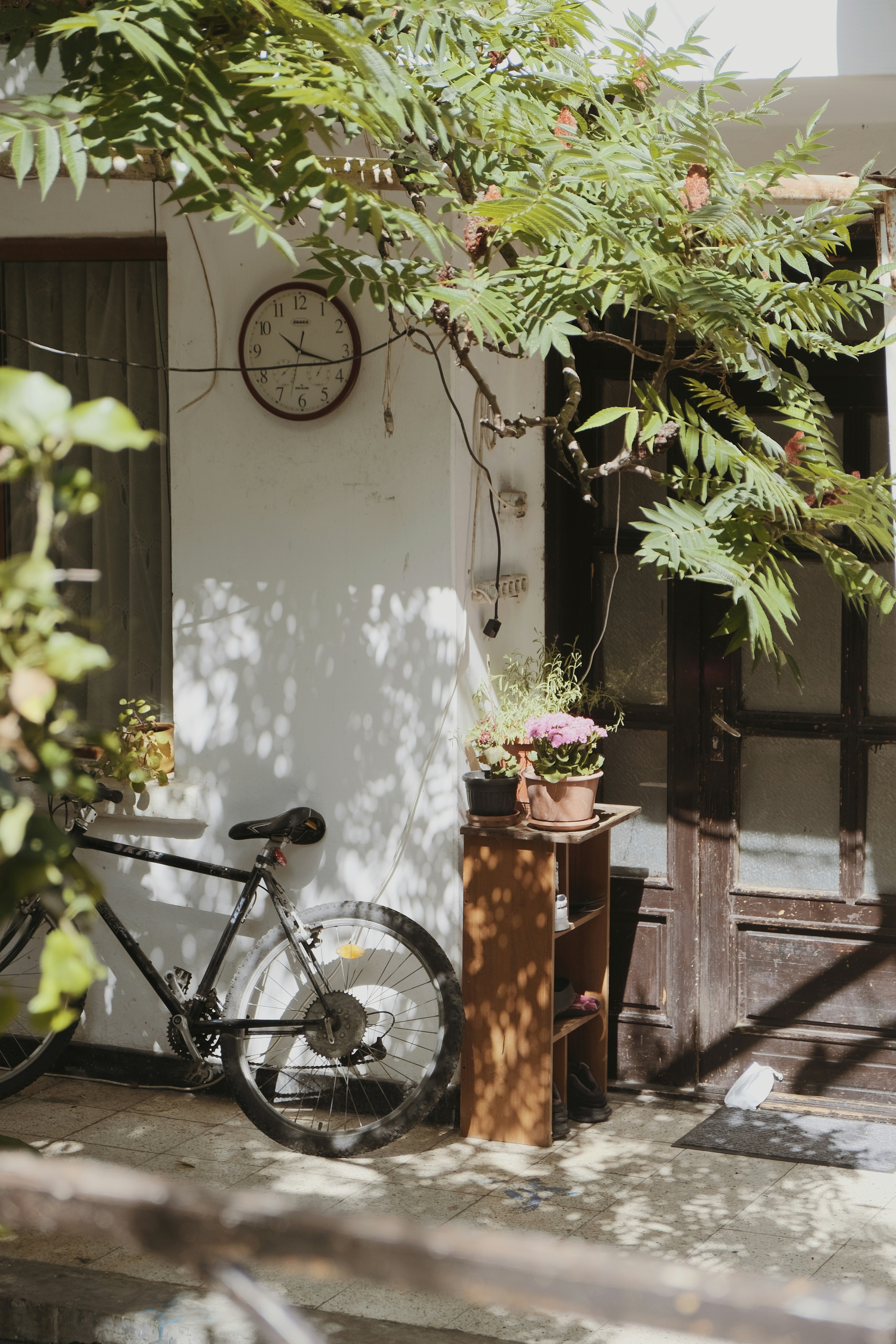 A bicycle parked in front of a house