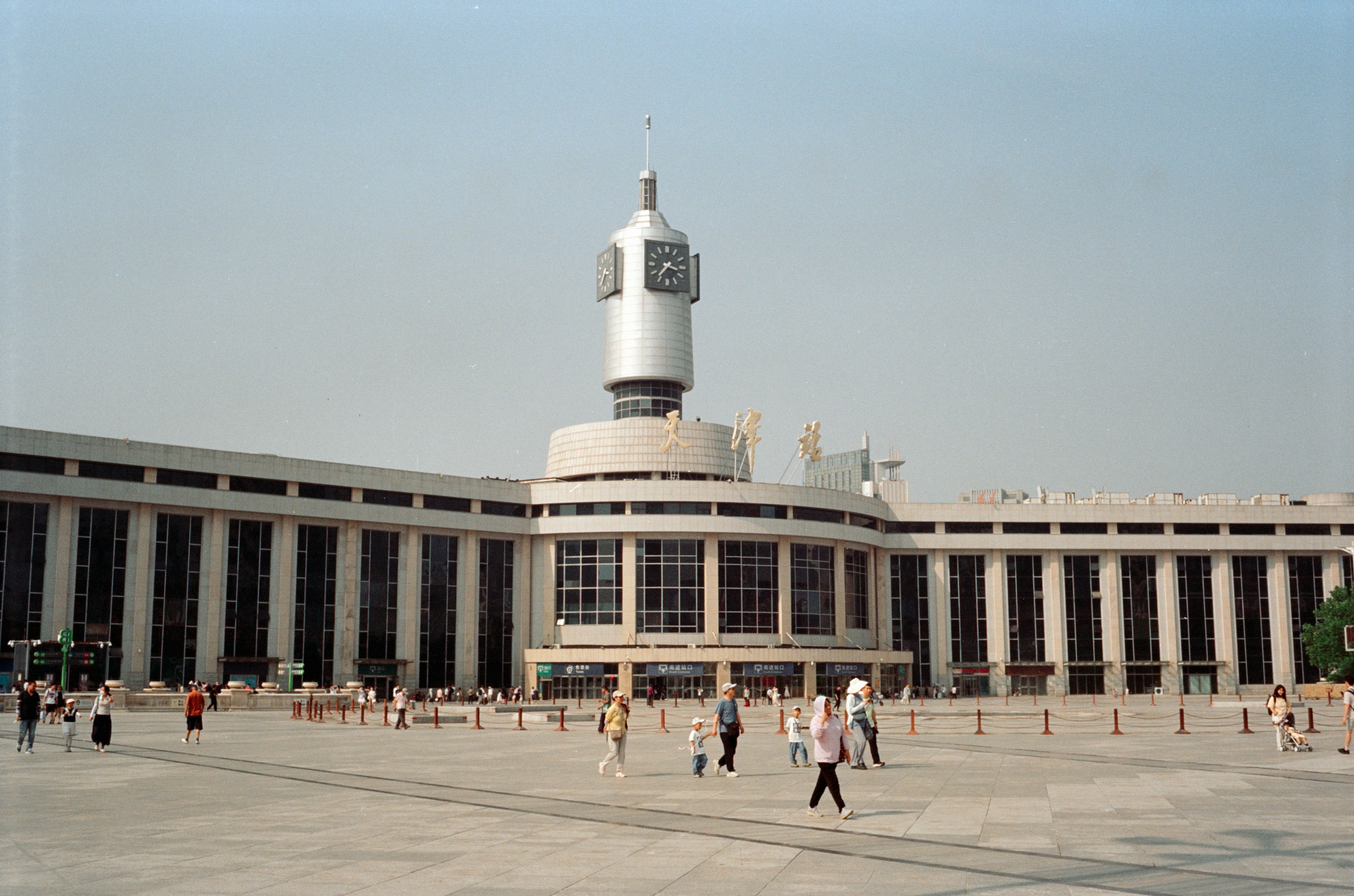A large building with a clock tower in the middle of it