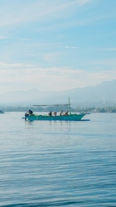 A group of people on a boat in the water