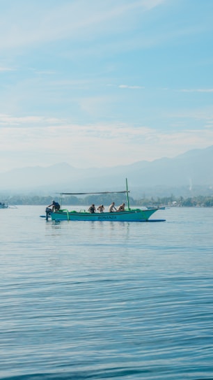 A group of people on a boat in the water
